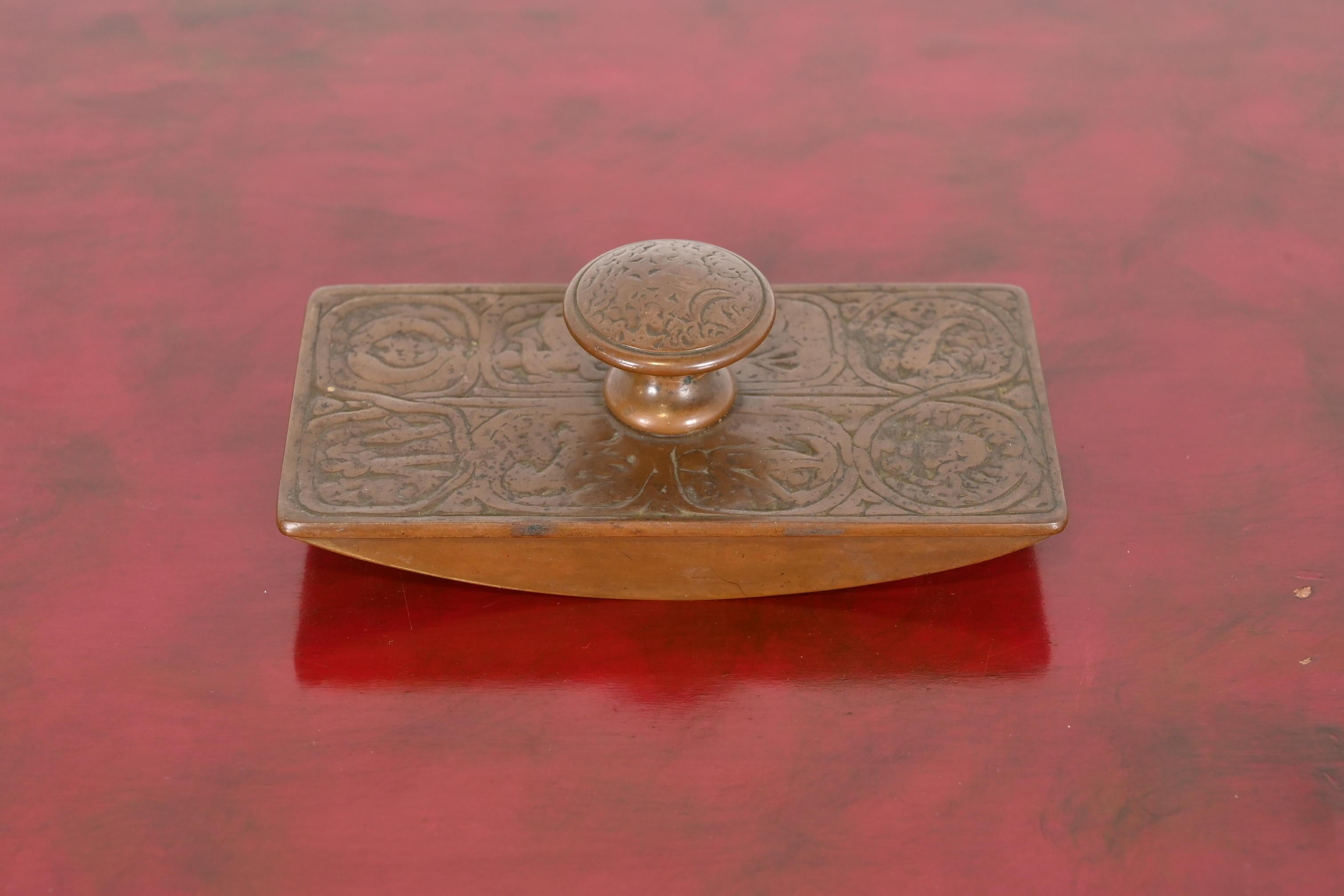 A gorgeous antique bronze rocker ink blotter featuring Zodiac designs

By Tiffany Studios (signed on the side)

New York, USA, Early 20th Century

Measures: 5.75