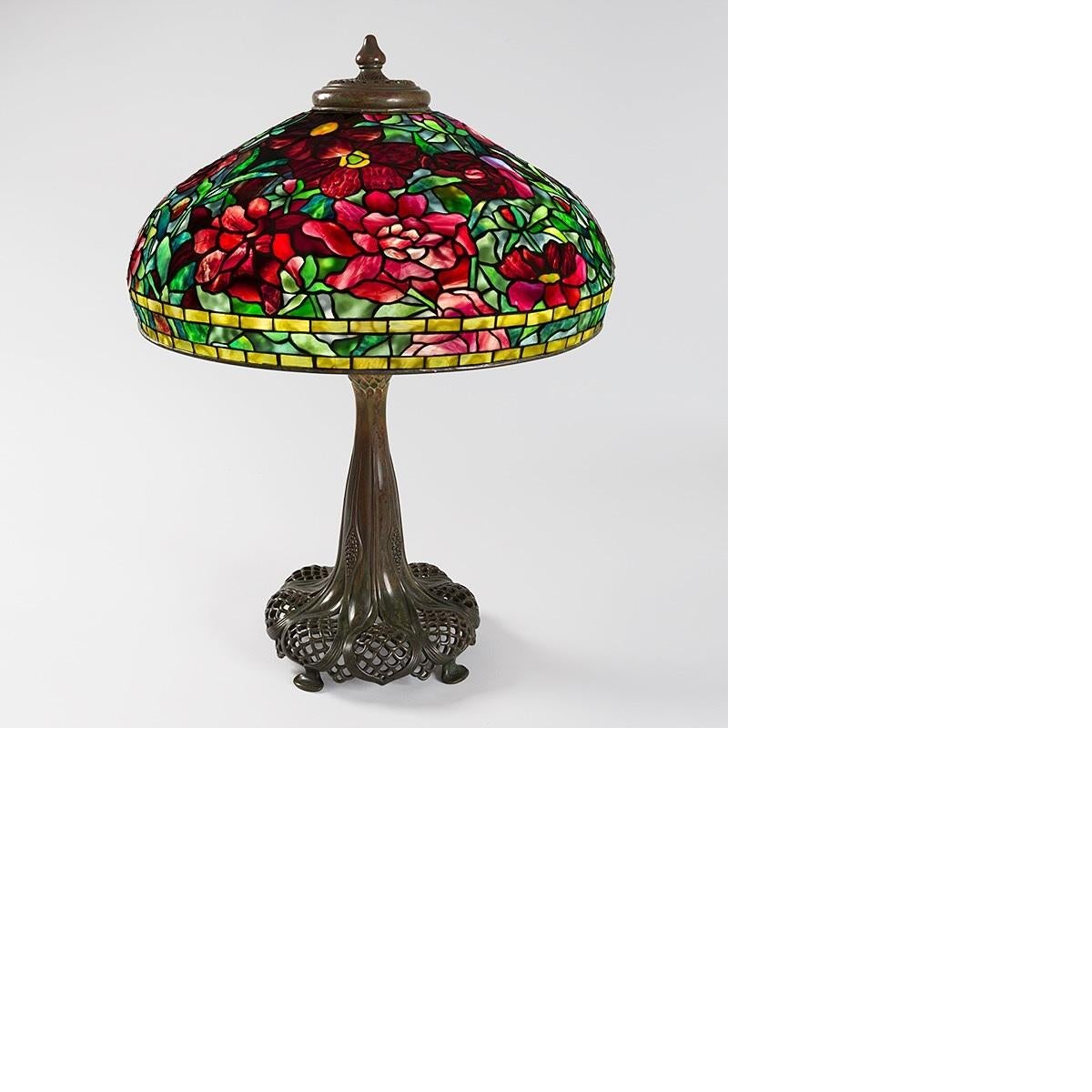 A Tiffany Studios New York “Peony” table lamp. The shade features three different peony cultivars from Tiffany’s garden at Laurelton Hall: the Greek Peony (Paeonia parnassica), Cup of Shining Night, and Shima Nishiki. This “Peony” lamp is an unusual