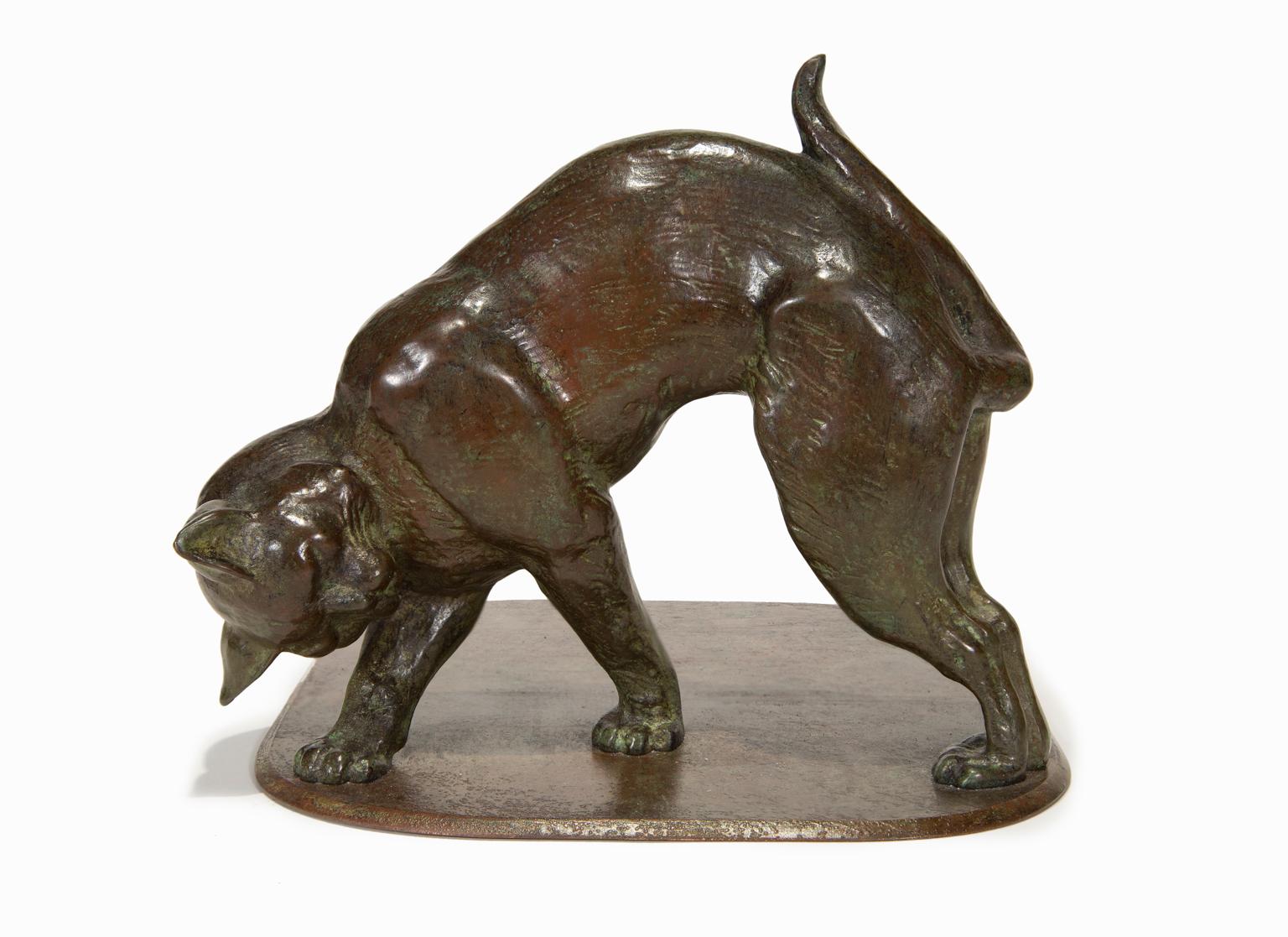 This pair of cast bronze cat bookends in a rich brown patina comes from the Tiffany Studios in New York and is signed on the bottom. These cats are in the Art Nouveau style enormously popular at the time of their creation.

Tiffany Studios has the