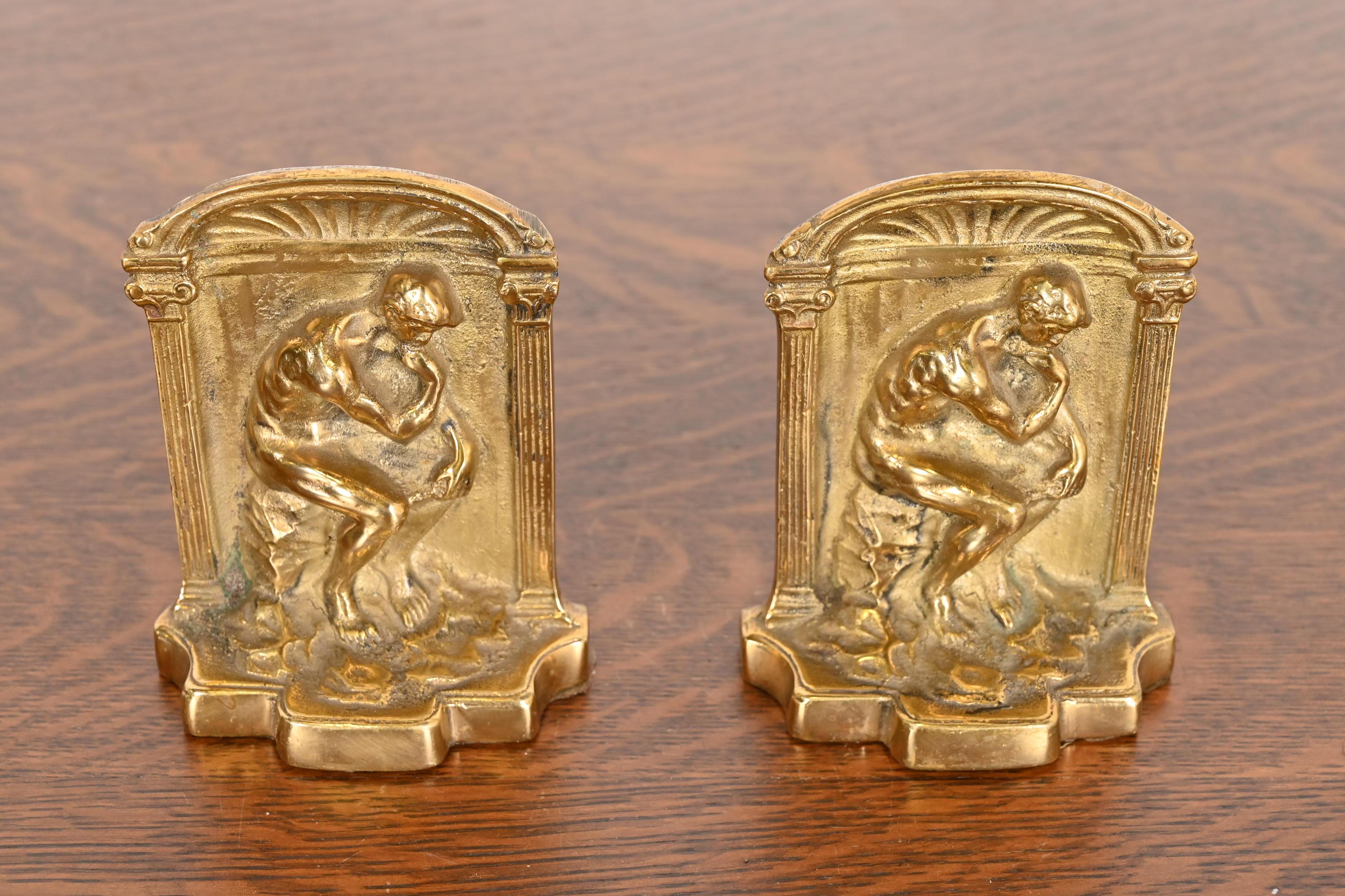 A gorgeous pair of Art Deco period gilt bronze bookends featuring 
