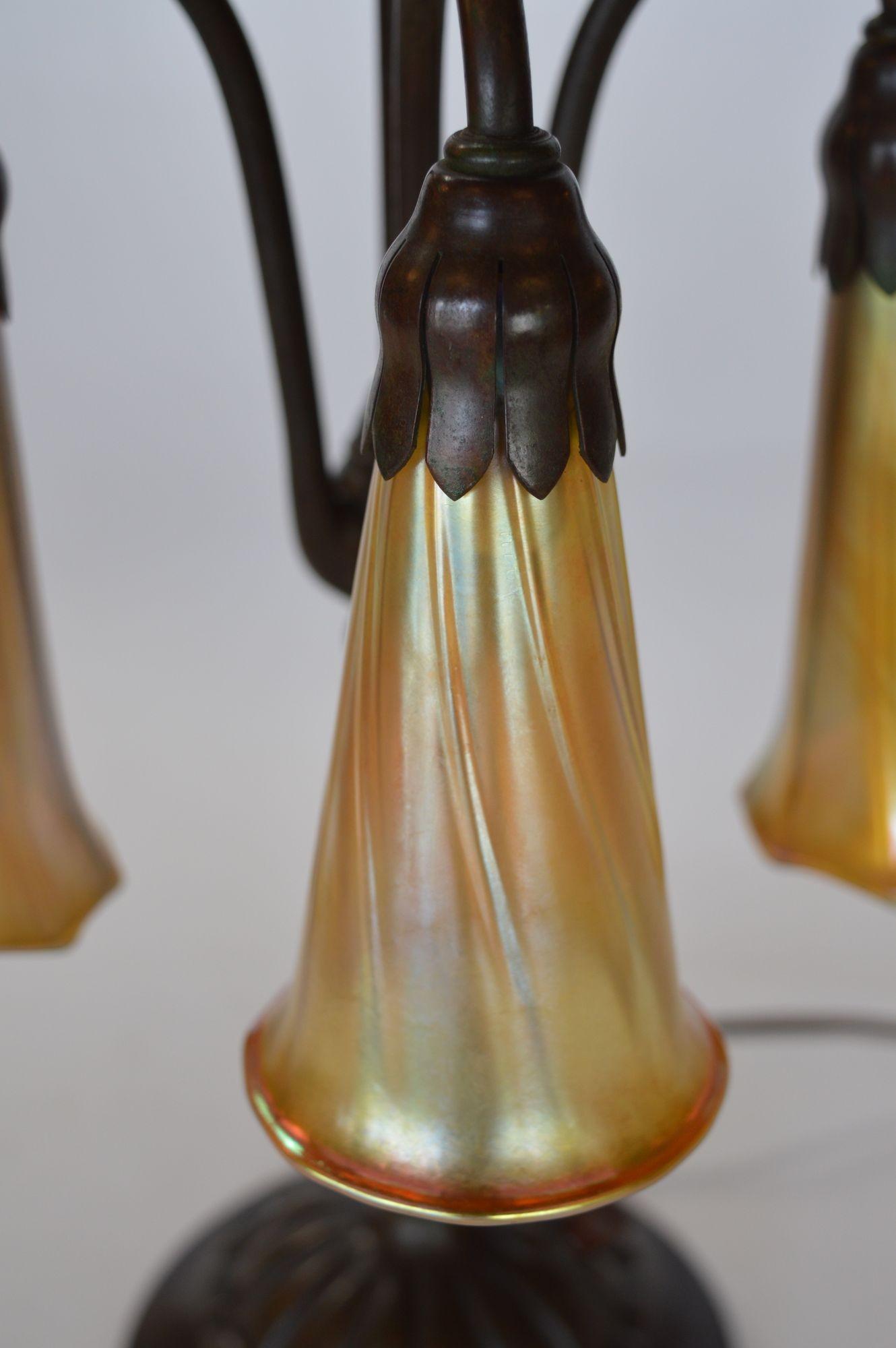 Tiffany Studios Three Light Lily Bronze and Favrile Table Lamp In Good Condition In Los Angeles, CA