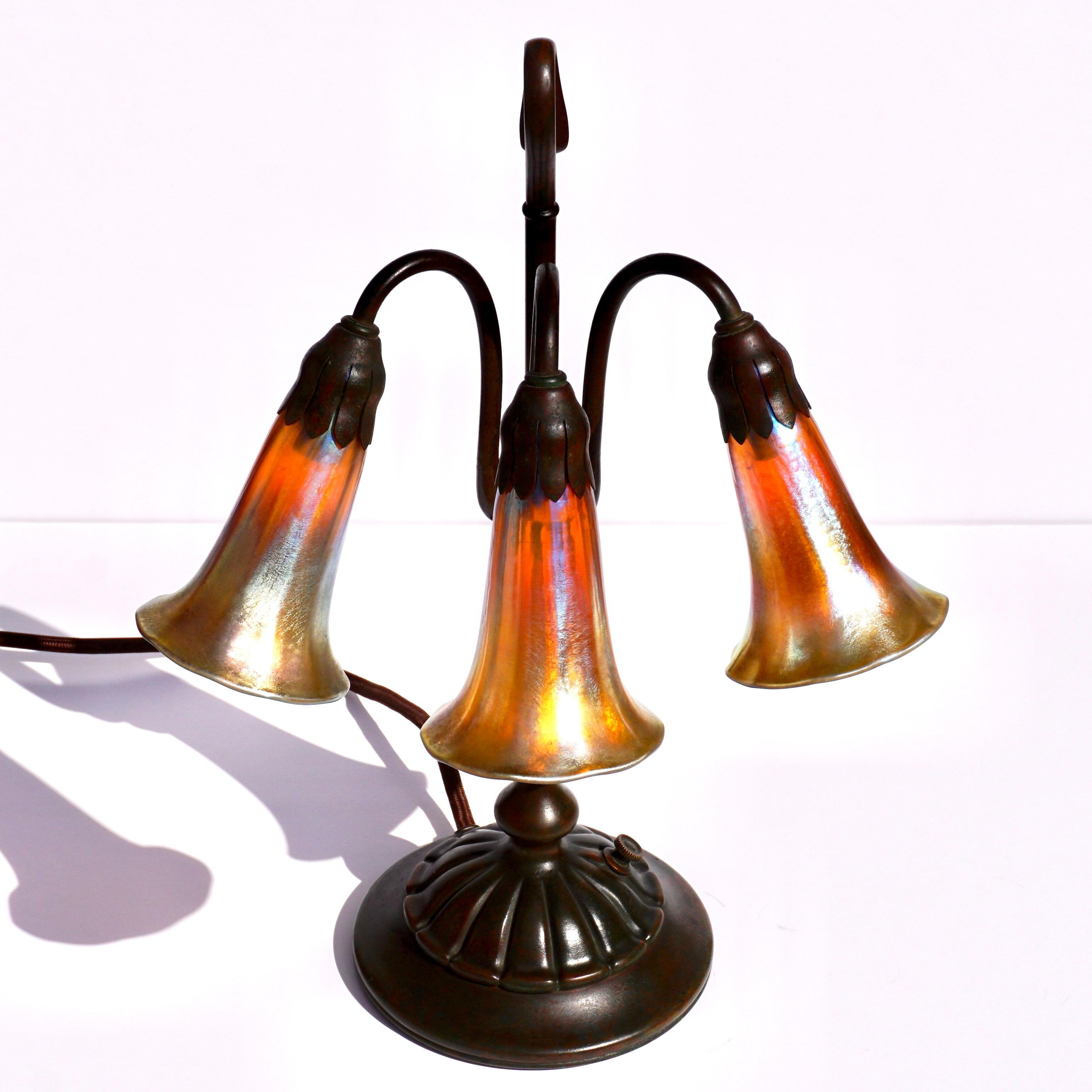 Art Nouveau Tiffany Studios Three Light Lily Favrile and Bronze Lamp