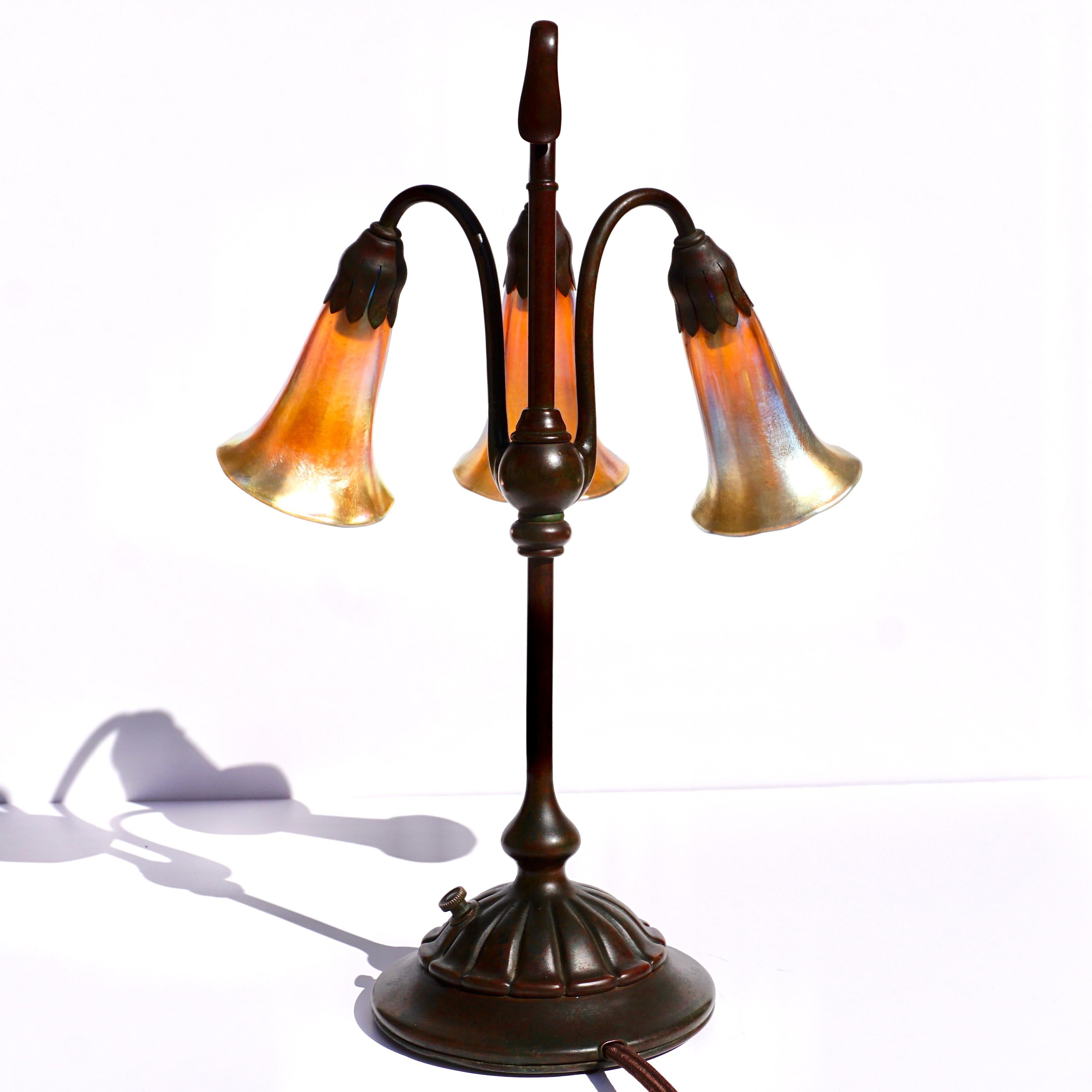 Tiffany Studios Three Light Lily Favrile and Bronze Lamp In Good Condition In Dallas, TX