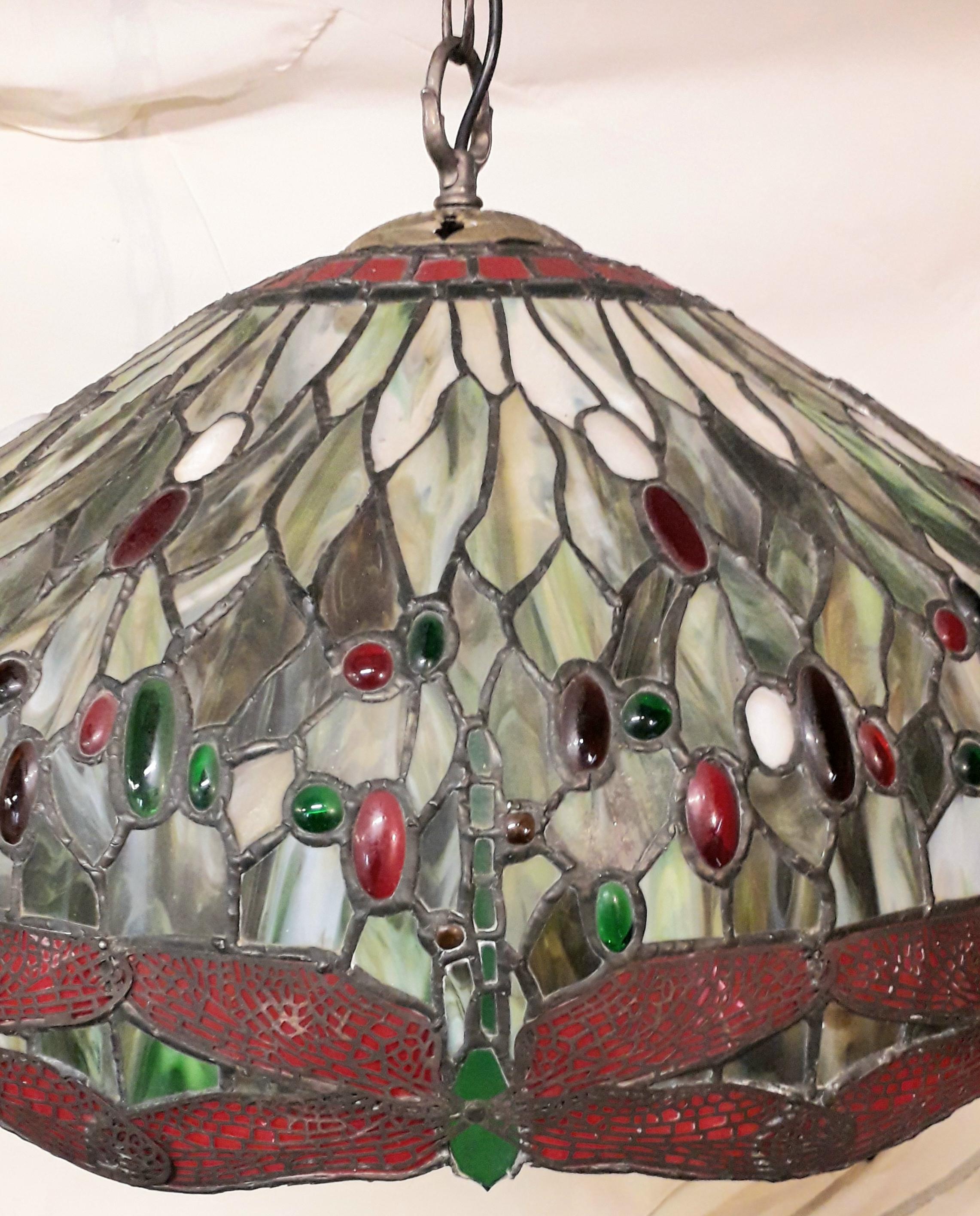 A superb large Tiffany style ceiling light, the lead light red and green cut glass with cabochon relief details, the surround has fine wire work showing inverted butterflies and the piece has excellent patinated lead so is not the normal bright new