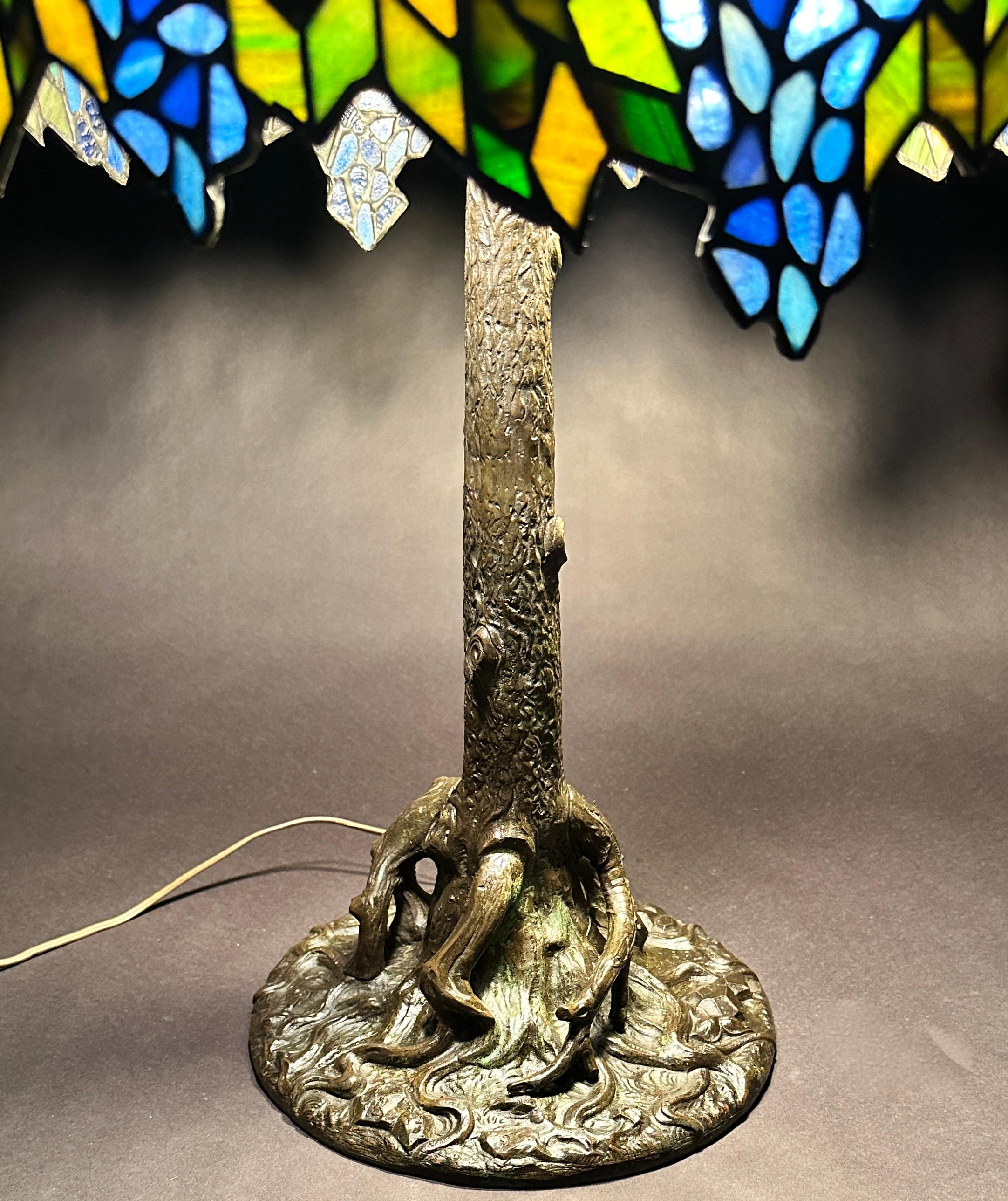 American Leaded Glass And Bronze Handel Tree Trunk Form Table Lamp