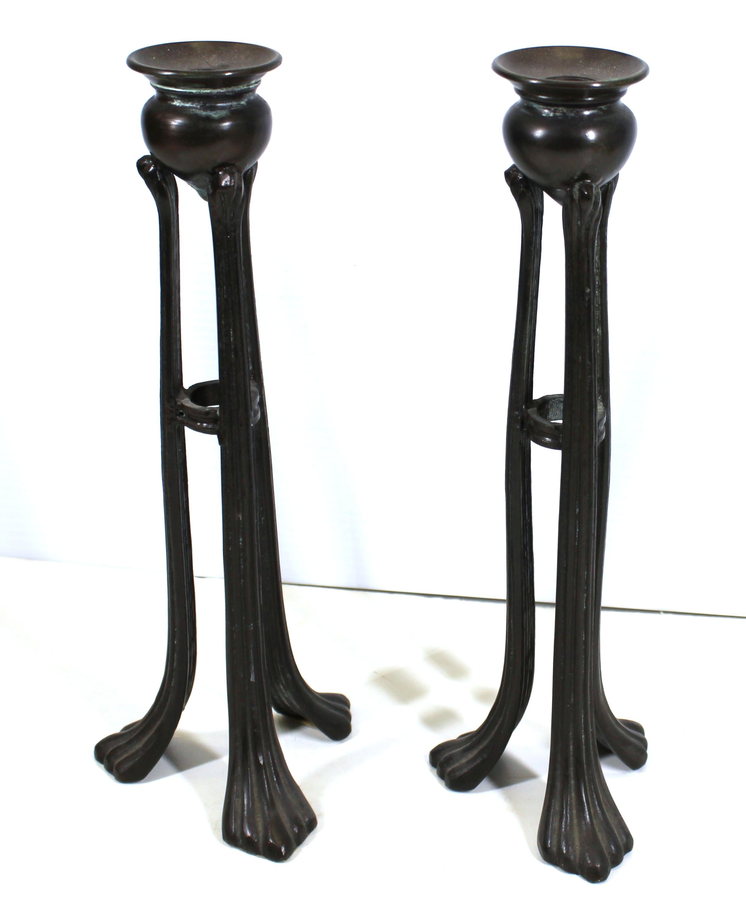 Tiffany style or Aesthetic movement tripod urn-form bronze candlesticks. Measures: 12.5
