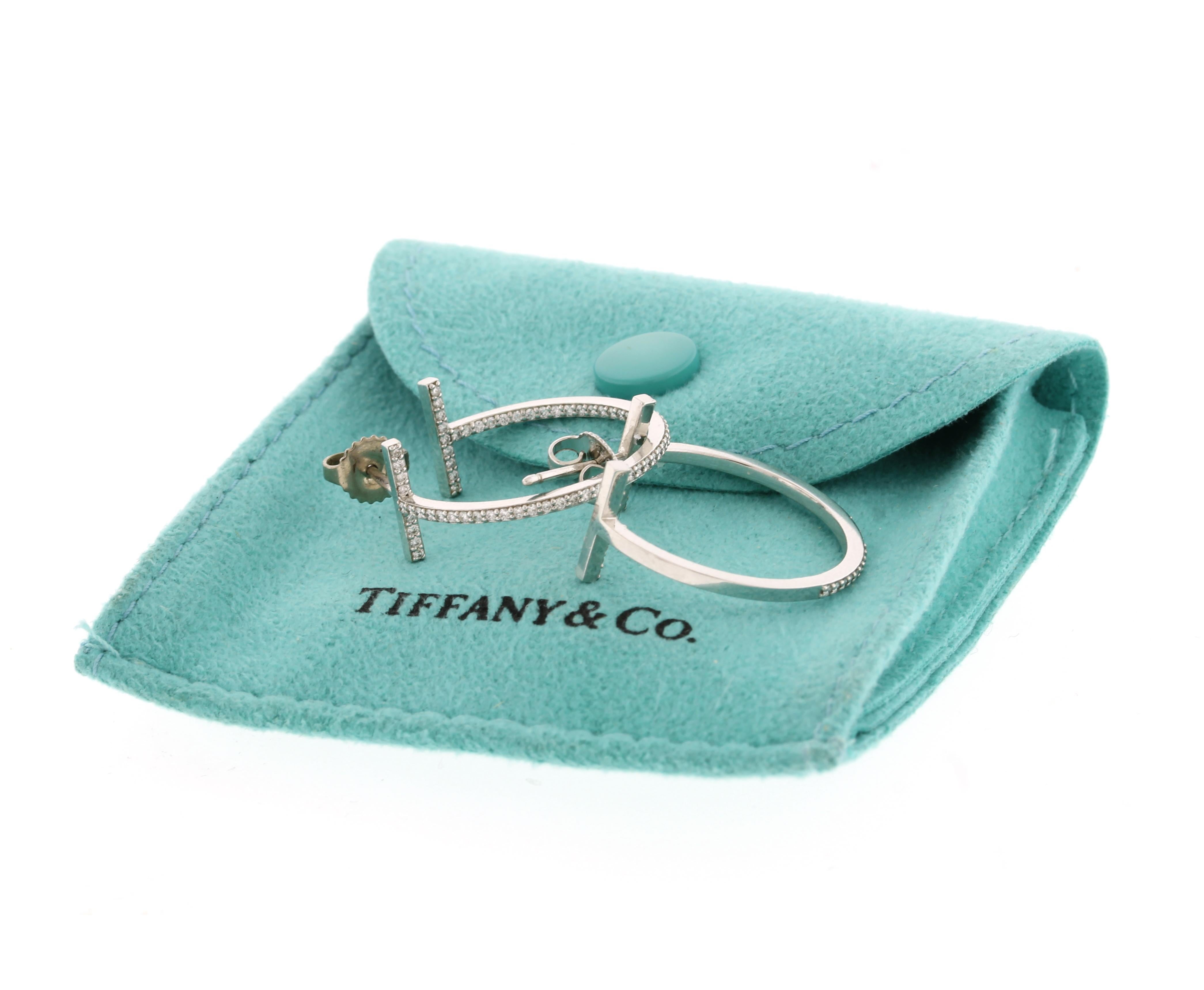 Brilliant diamonds elegantly outline these hoop earrings. As multifaceted as it is iconic, the Tiffany T collection is a tangible reminder of the connections we feel but can't always see. Style these earrings with a simple Tiffany necklace to