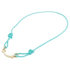 Tiffany T Smile Bracelet in Yellow Gold on a Blue Cord
