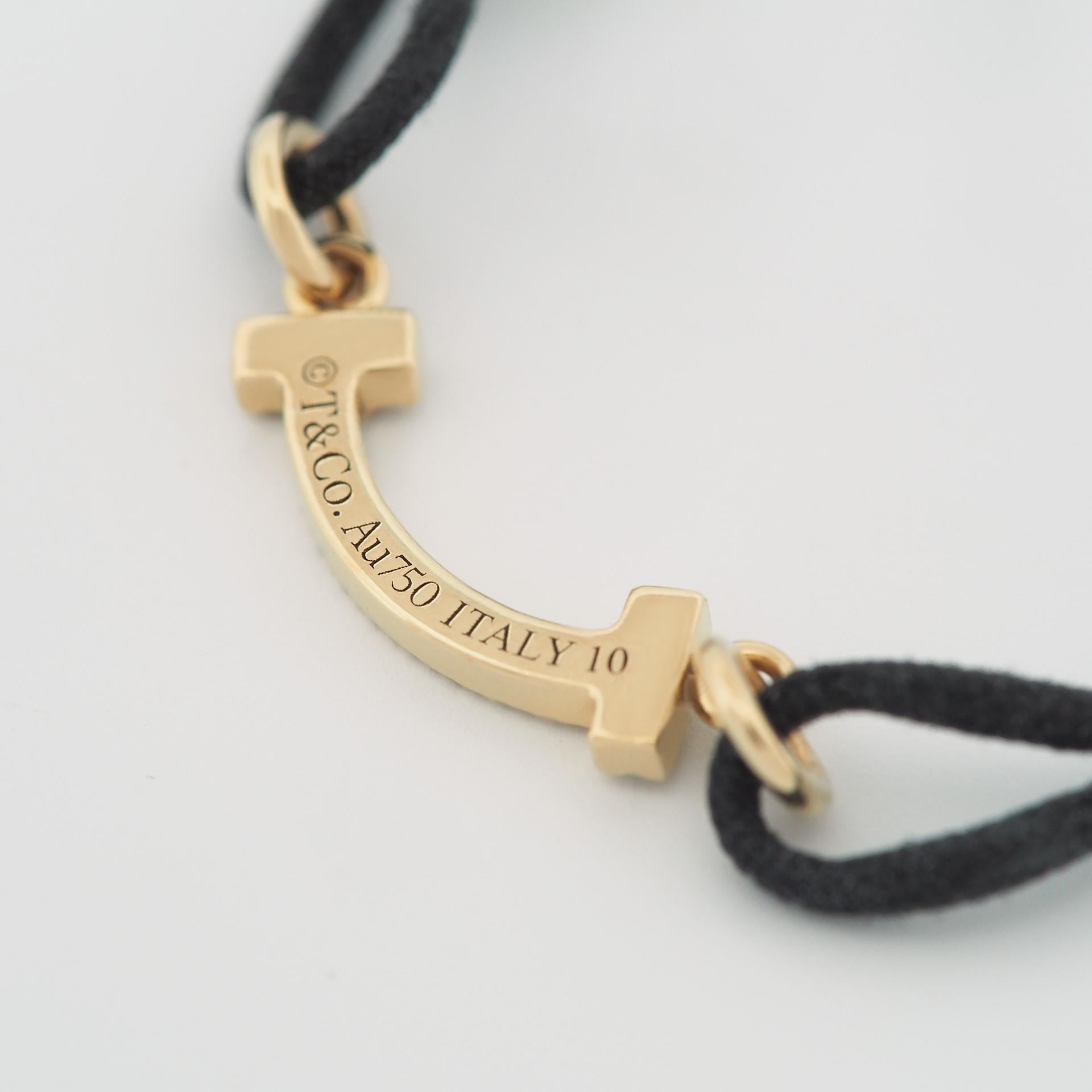 Femenino o masculino Tiffany T Smile Pulsera Con Diamantes Oro Amarillo Edición Limitada Cordón Negro en venta
