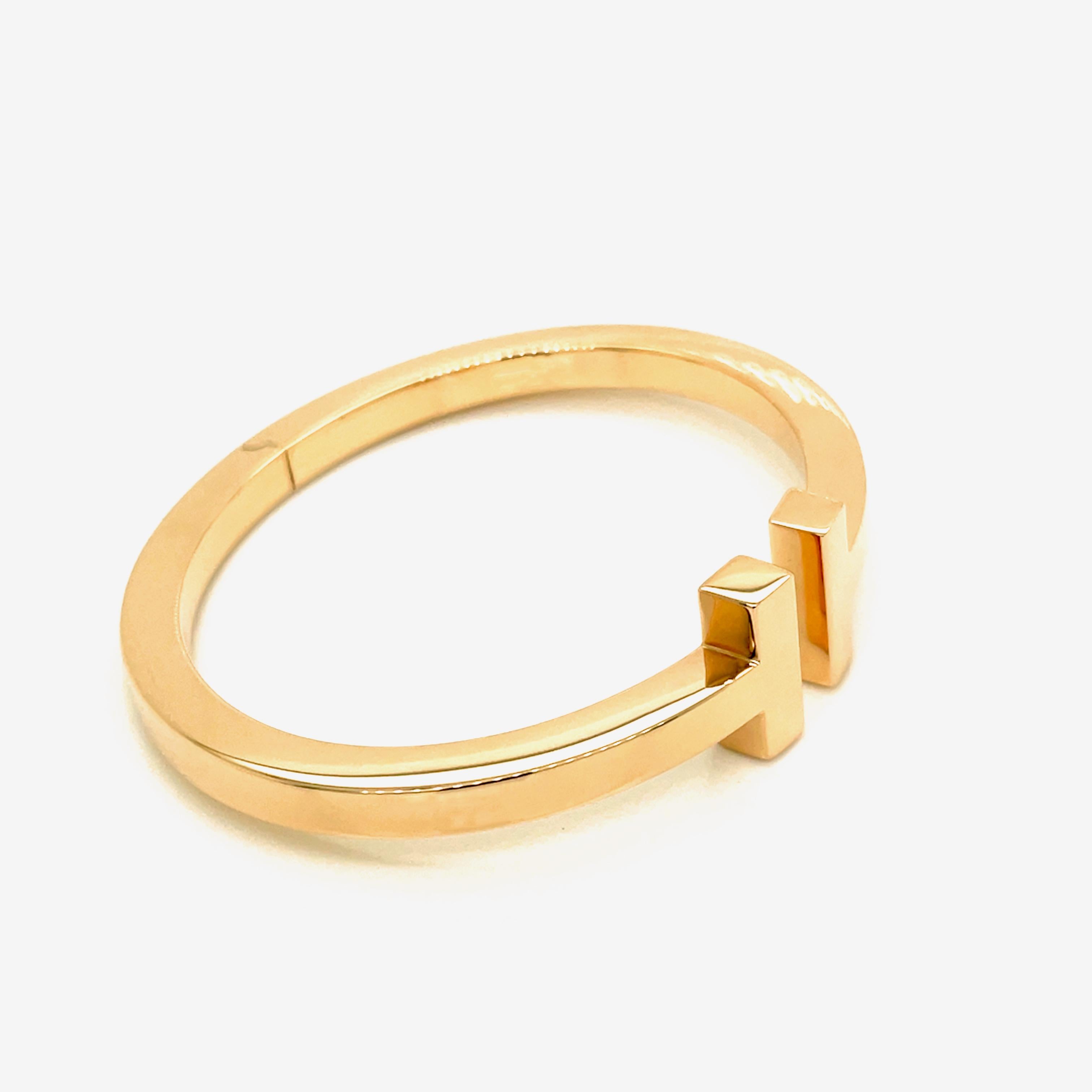 This bold bracelet exudes sophistication. As multifaceted as it is iconic, the Tiffany T collection is a tangible reminder of the connections we feel but can't always see. Wear this sleek design in a mixed-metal bracelet stack for a modern
