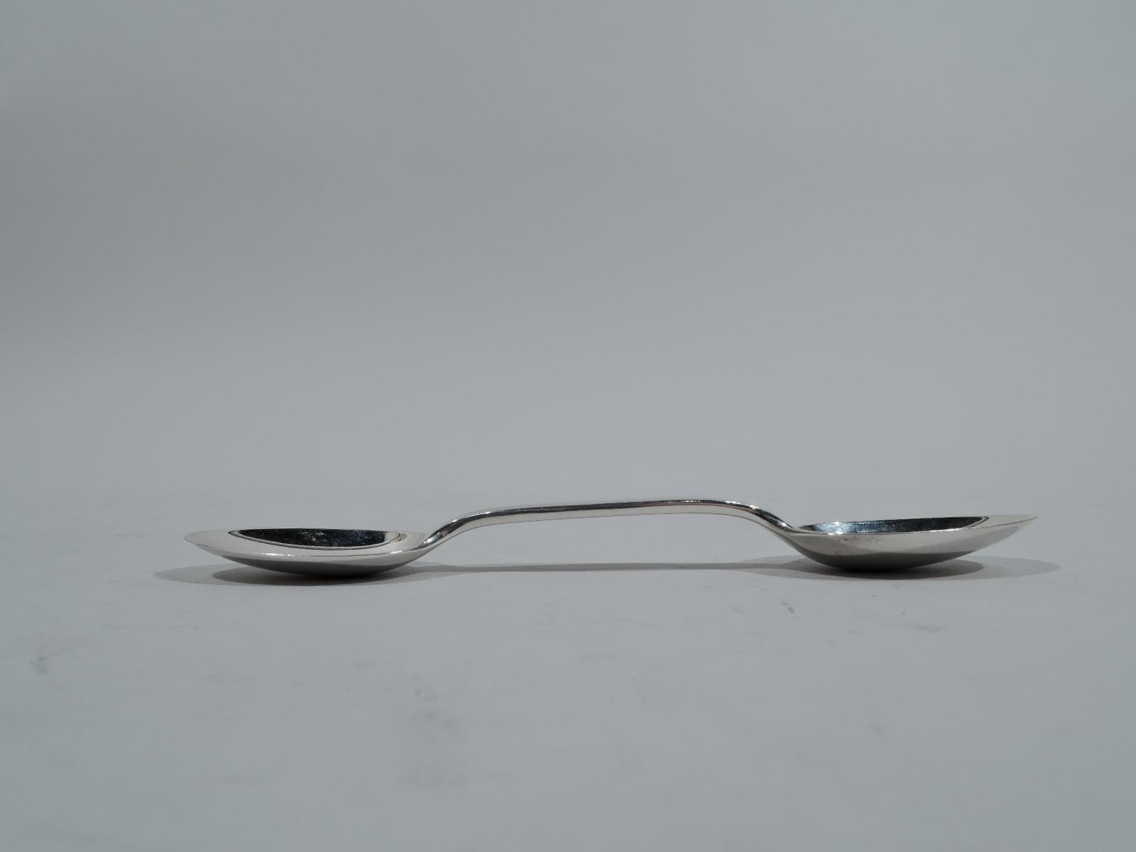 Traditional sterling silver medicine spoon. Made by Tiffany & Co. in New York, circa 1920. Large and small bowls joined by gently curved stems. Sizes are approximately teaspoon and half teaspoon. Convenient for home dosing. Fully marked including