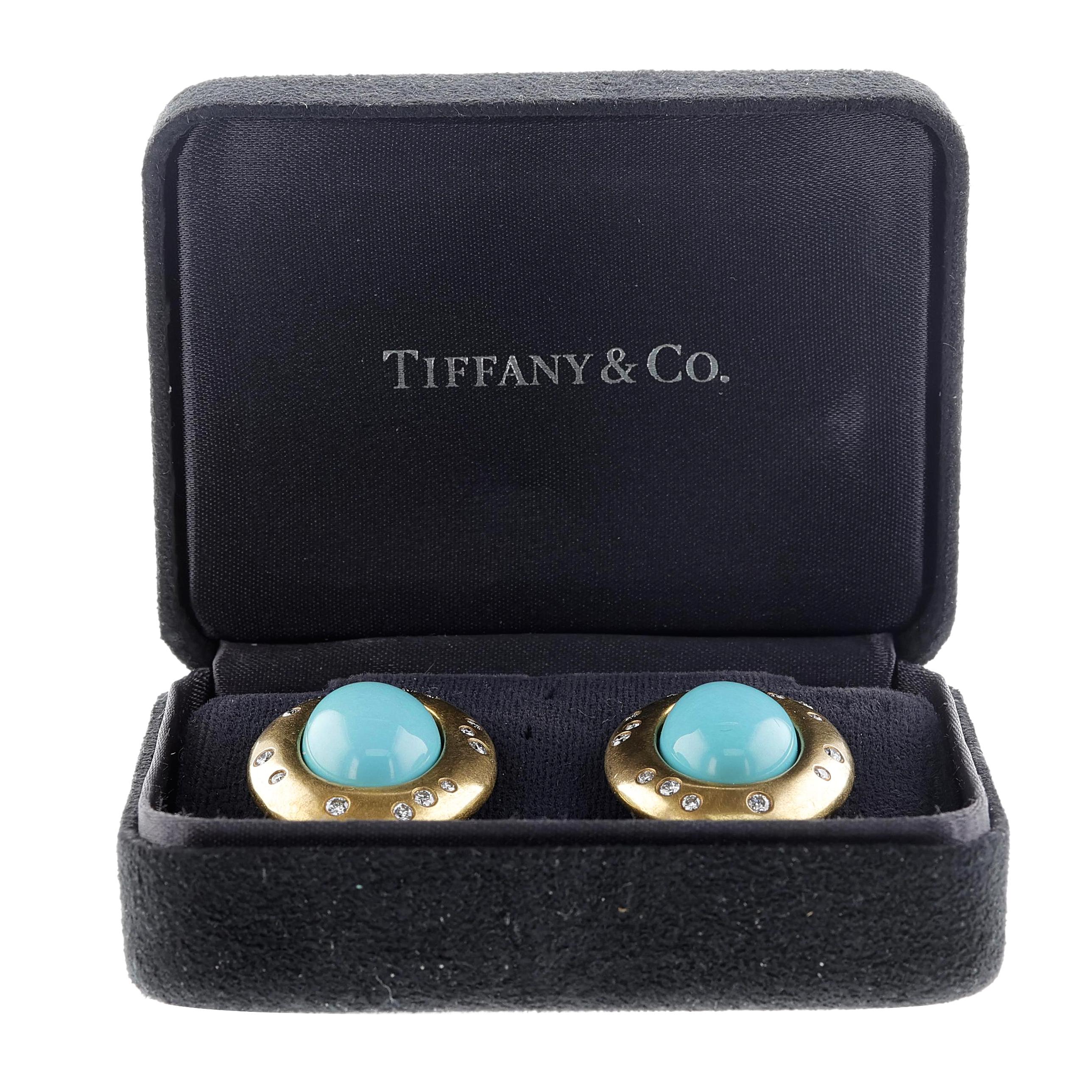 A pair of Tiffany Turquoise Cabochon Earrings with Diamonds made in 18k yellow gold. The earrings weigh 29.27 grams, measuring 1.14 inches x 0.90 inches. The turquoise cabochon measures 17x12 mm. The diamonds weigh appx. 0.36 carats, and the
