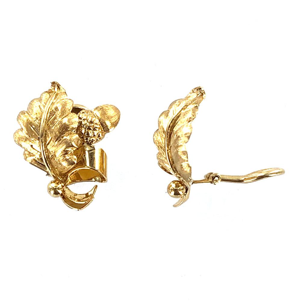 Tiffany & Co. vintage leaf motif earrings fashioned in 18 karat yellow gold. The earrings measure 1.0 inch in length and .80 inches in width. Signed Tiffany & Co. 18K Italy. The earrings feature clip backs. Weight: 7.8 grams. Tiffany pouch included.
