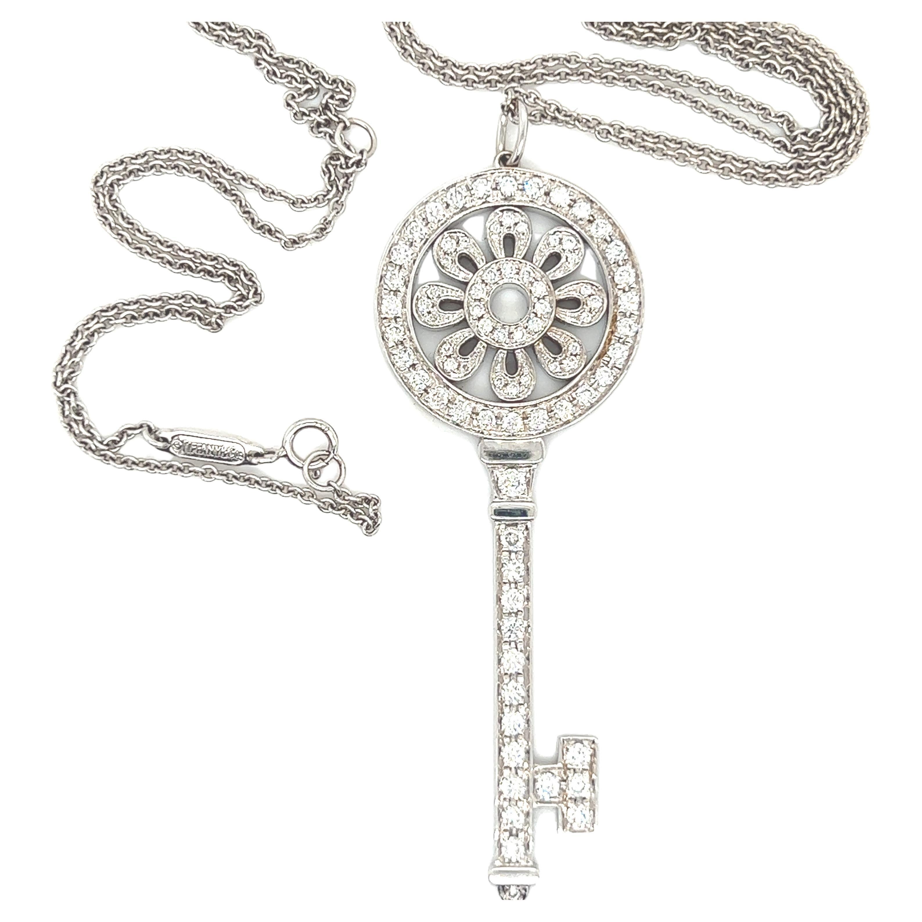 Tiffany white gold diamond large petal key pendant and chain.  For Sale