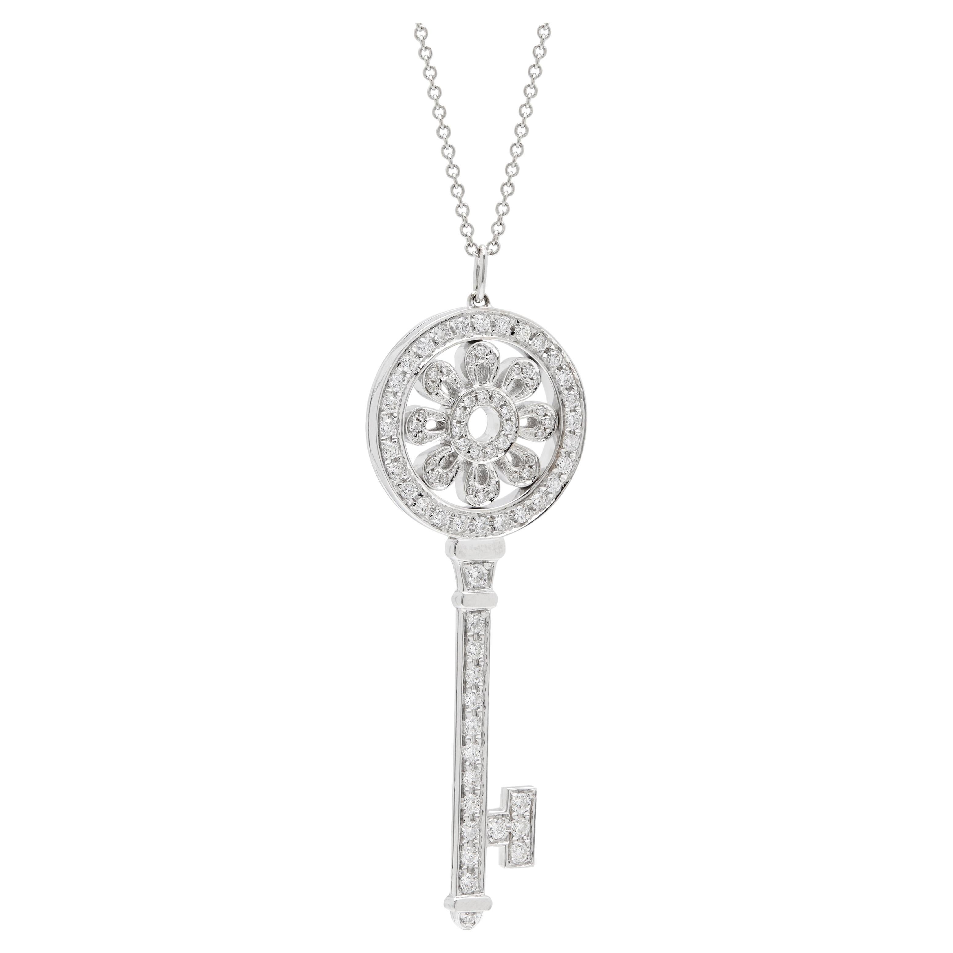 Tiffany white gold diamond large petal key pendant and chain.  For Sale