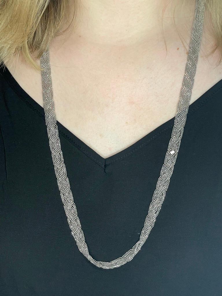 A fabulous find:  a long necklace consisting of multiple individual strands of diamond-cut ball chain.  Made by TIFFANY & CO.  In person, this chain looks like it is fully set with shimmering sparkling diamonds, although it is fully made in 18K