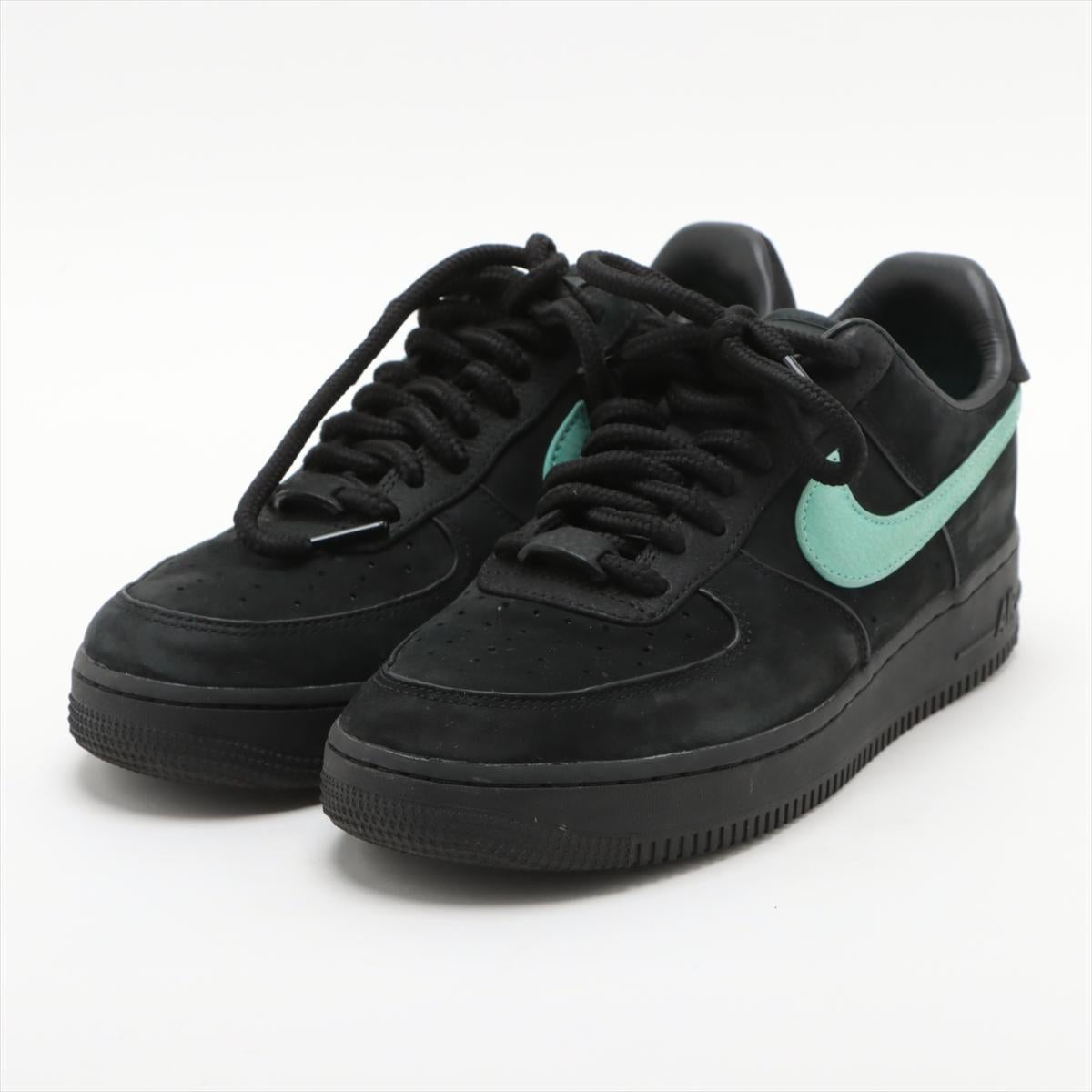 The Tiffany x Nike Air Force 1 Low Leather Sneaker in Black and Blue is a striking collaboration that combines luxury with athletic style. The sneakers feature a premium black leather upper, offering a sleek and sophisticated look. The standout
