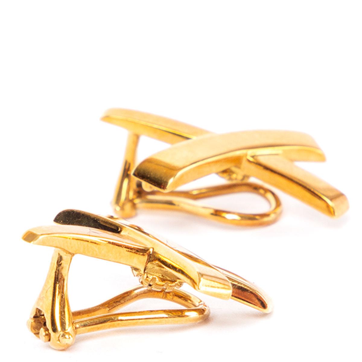 100% authentic Tiffany & Co. 1980s large Paloma Picasso 18 Kt. Gold Graffiti X clip earrings. Fully signed Paloma Picasso and Tiffany & Co. From the iconic 1980's Graffiti X collection. Have been worn and are in excellent condition. Come with box.