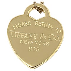 Tiffany & Co. Pendentif en forme de cœur en argent et plaqué or jaune 925