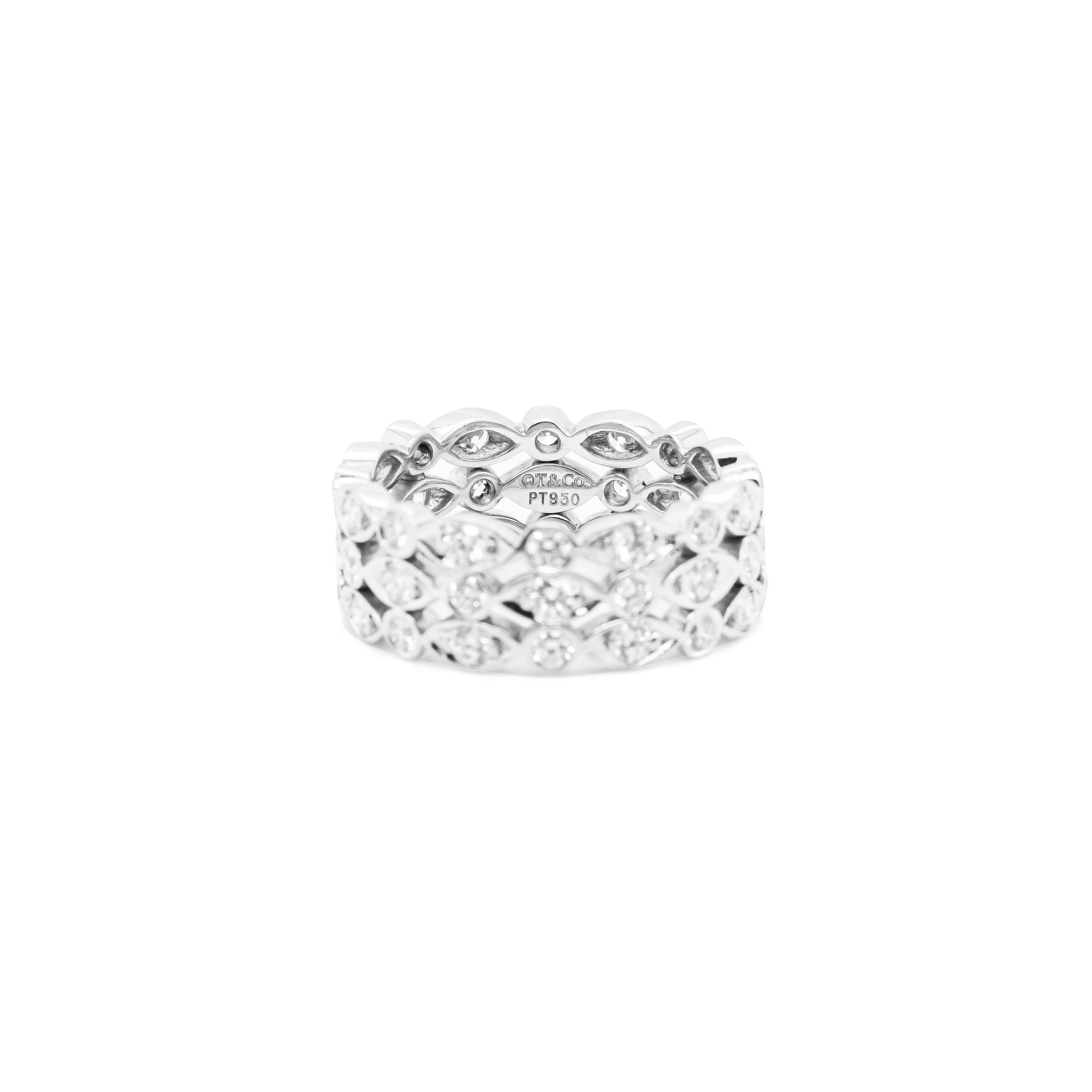 This beautiful ring designed by Tiffany&Co features three rows of alternating round and marquise shaped settings each inlaid with a round brilliant cut diamond. There are a total of 48 diamonds that come to an approximate weight of 1.45 carats all