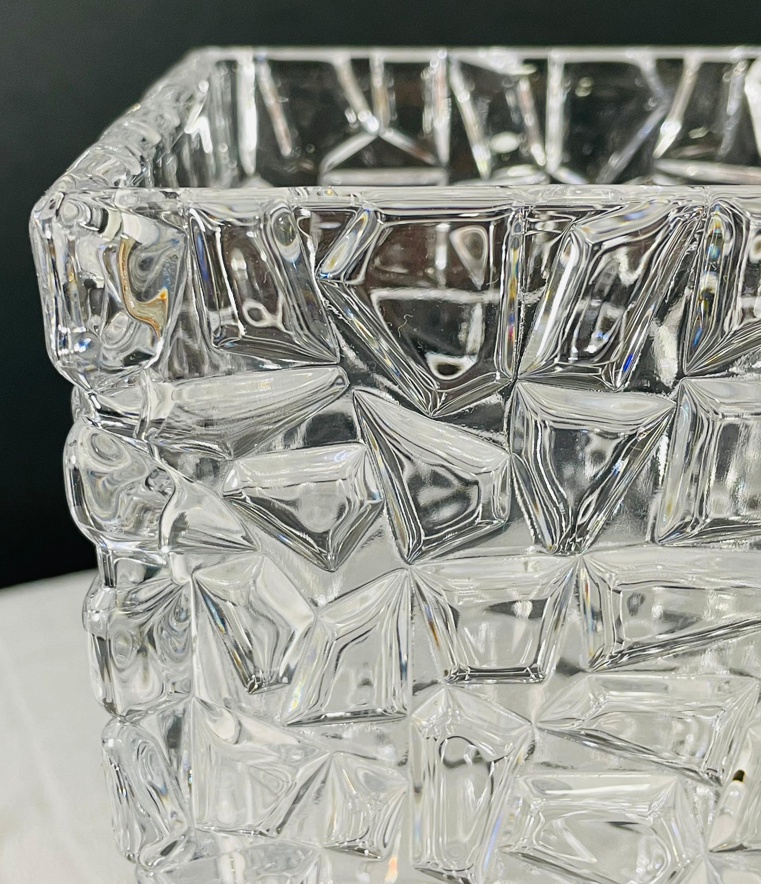 A contemporary Tiffany and Co crystal vase signed on the bottom side. The vase features modern geometrical patterns design which makes it stylish and elegant. 

Dimensions: 4.5