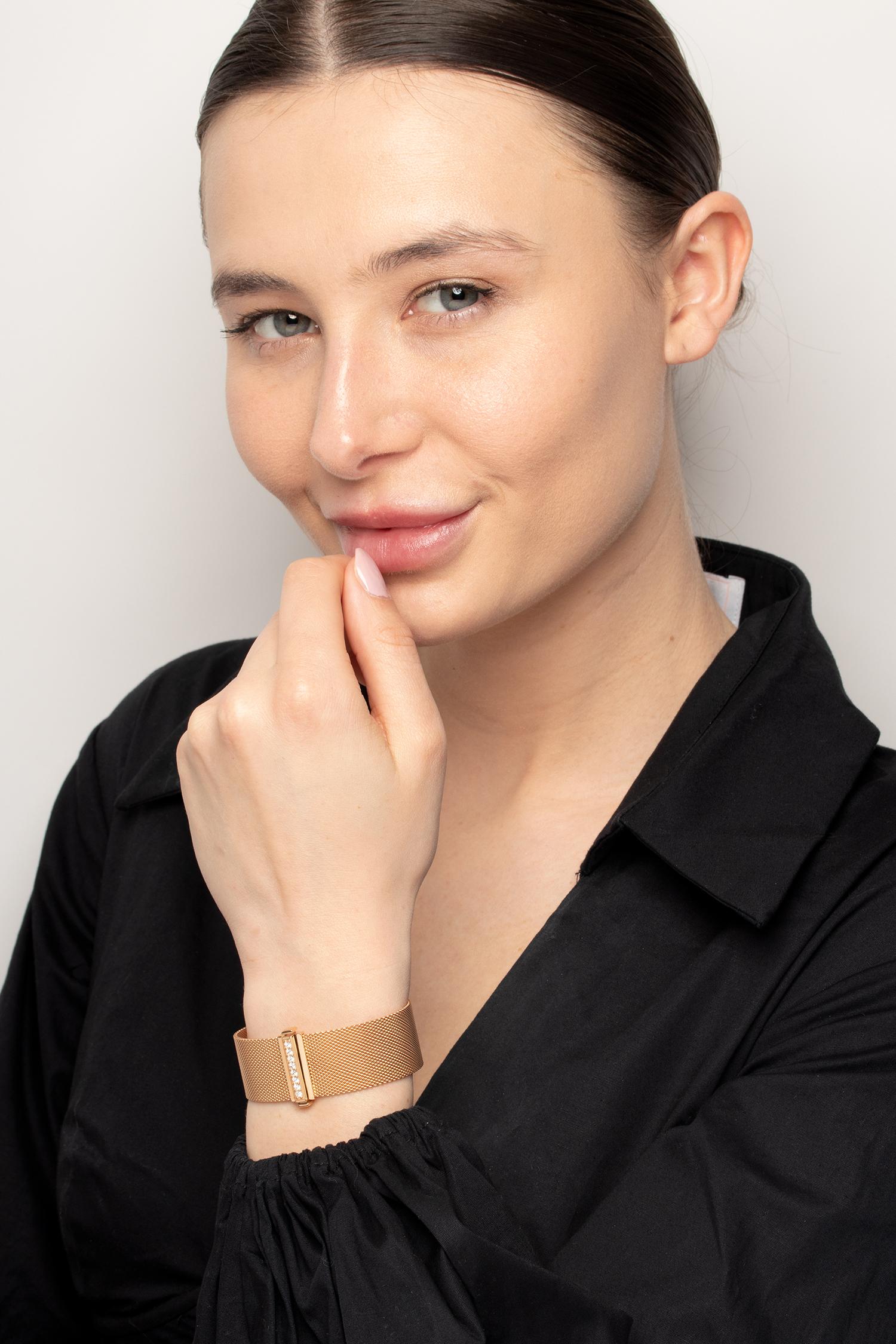 Woven 18 carat rose gold mesh closes with a diamond clasp in this Tiffany & Co. bracelet. It is part of the 'Somerset' Collection. The golden mesh lays softly against the skin. The clasp is embellished with eight 0.03 carat diamonds. They are