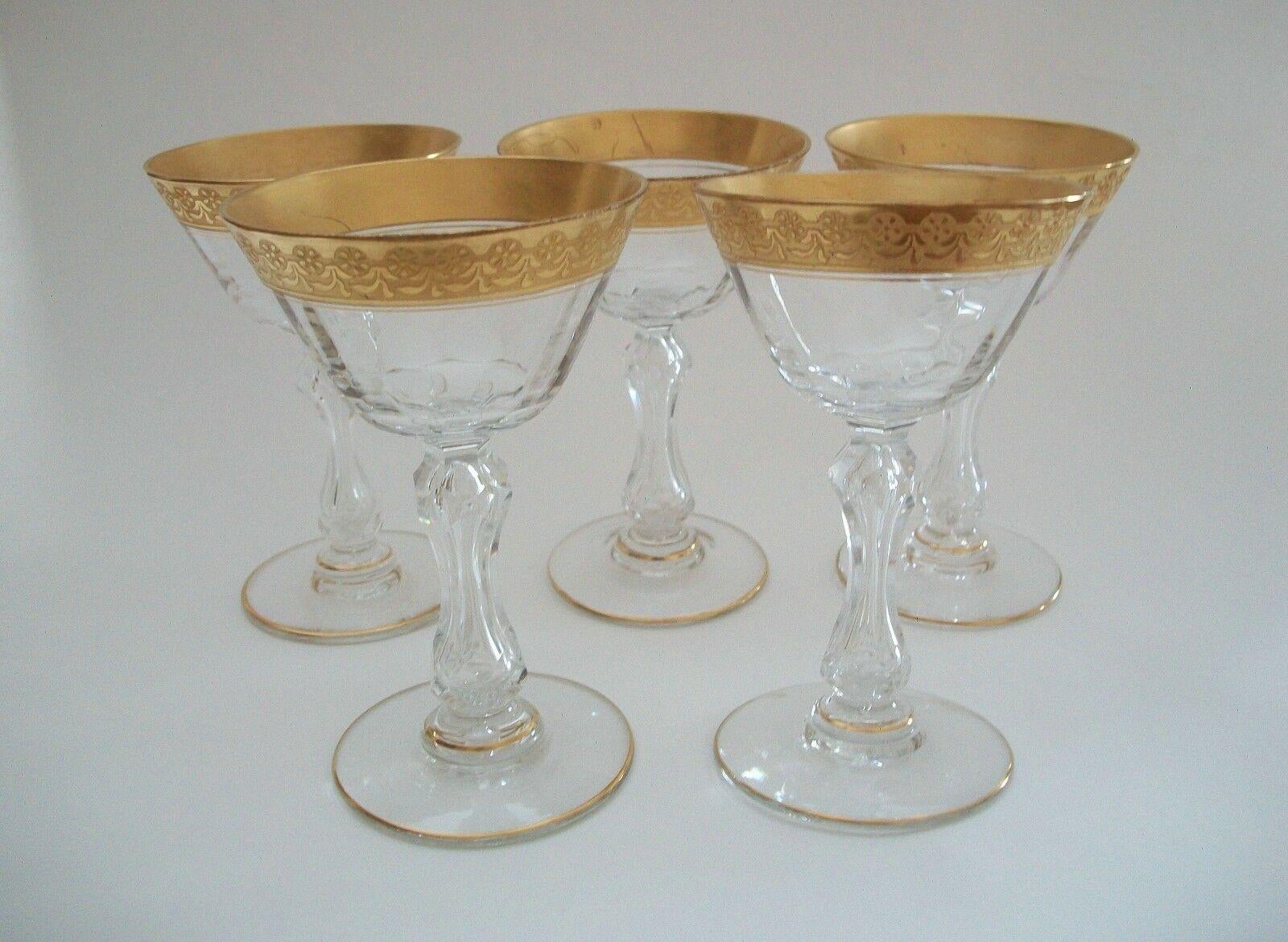 Tiffin Glass - Finest quality set of five wheel cut crystal sherry or liqueur glasses - Art Nouveau style engraved florals to the 24K gold rims - gold details to the base - cut crystal stems - unsigned - United States - circa 1950's.

Good vintage