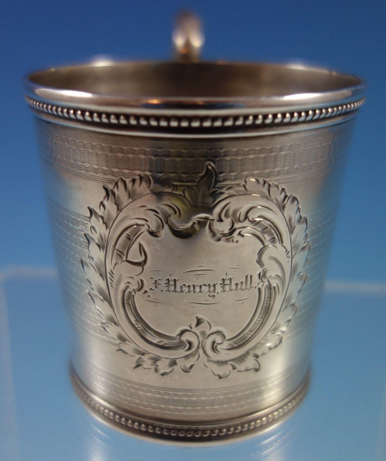 Coin silver baby cup made by Tifft and Whiting. The cup has a engine turned and bright-cut design, and has a monogram that reads F. Henry Hull (see photo). The baby cup measures 3 x 3 3/4 . It is in good vintage condition. 

 


 