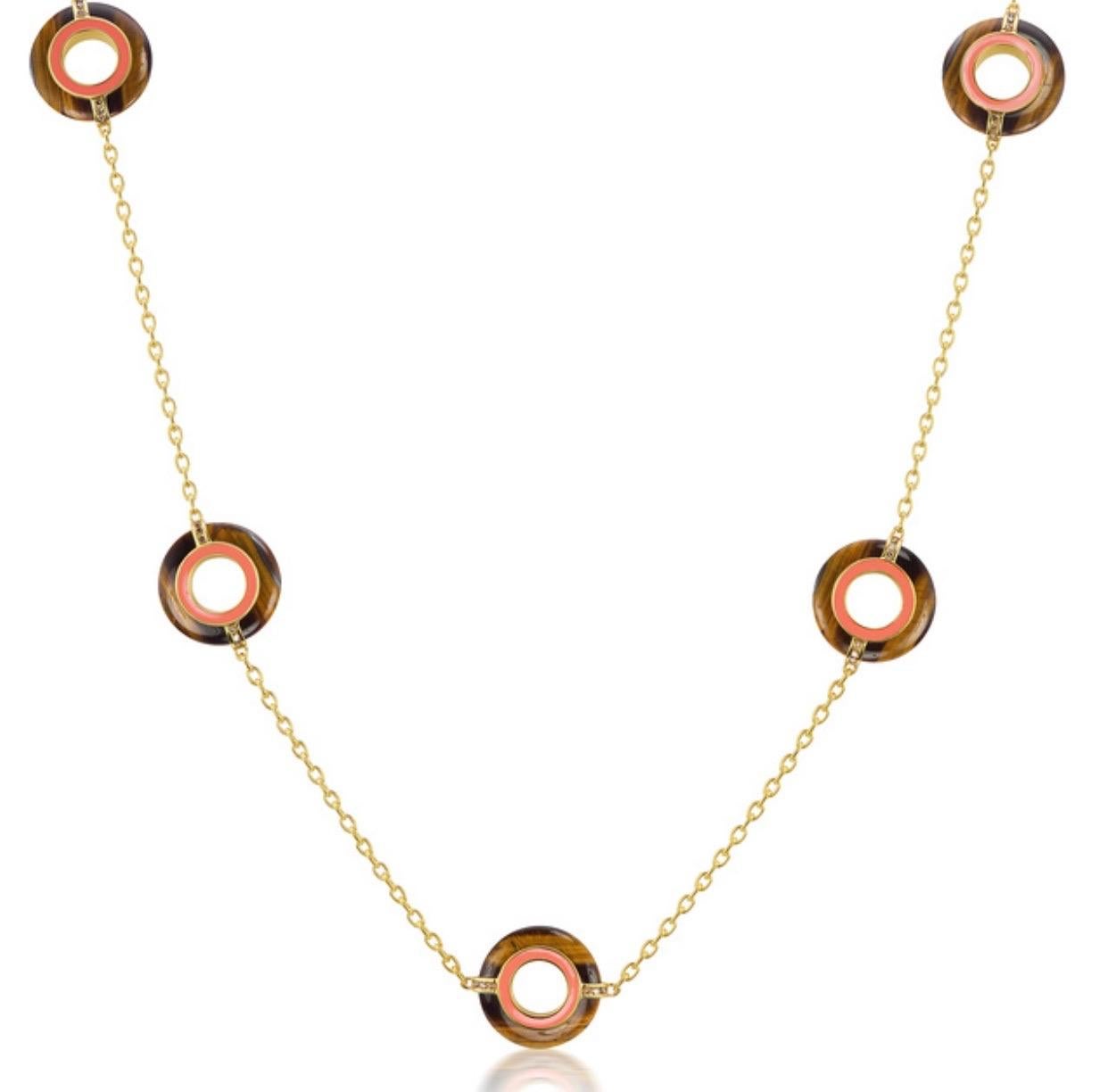 Andrew Glassford's Donut Series III 26 inch long necklace makes a beautiful statement piece that can be worn two ways. Five 20mm Tiger-Eye Chalcedony discs weighing 41 carats anchor this necklace. On one side of necklace are .40 carats of Champagne