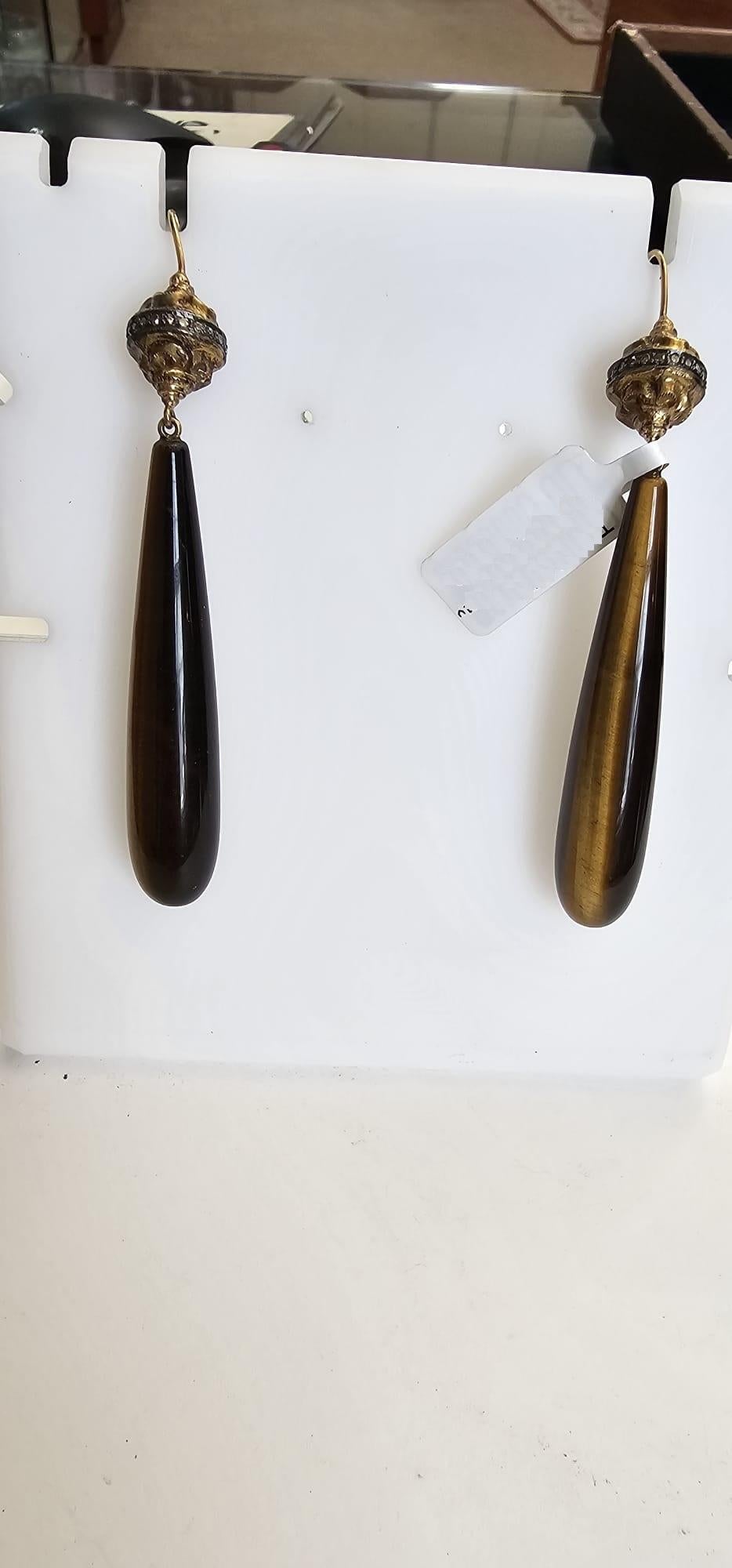 14kt:3.9g,
Diamond:0.58ct,
Silver:1.78g,
Tiger Eye: