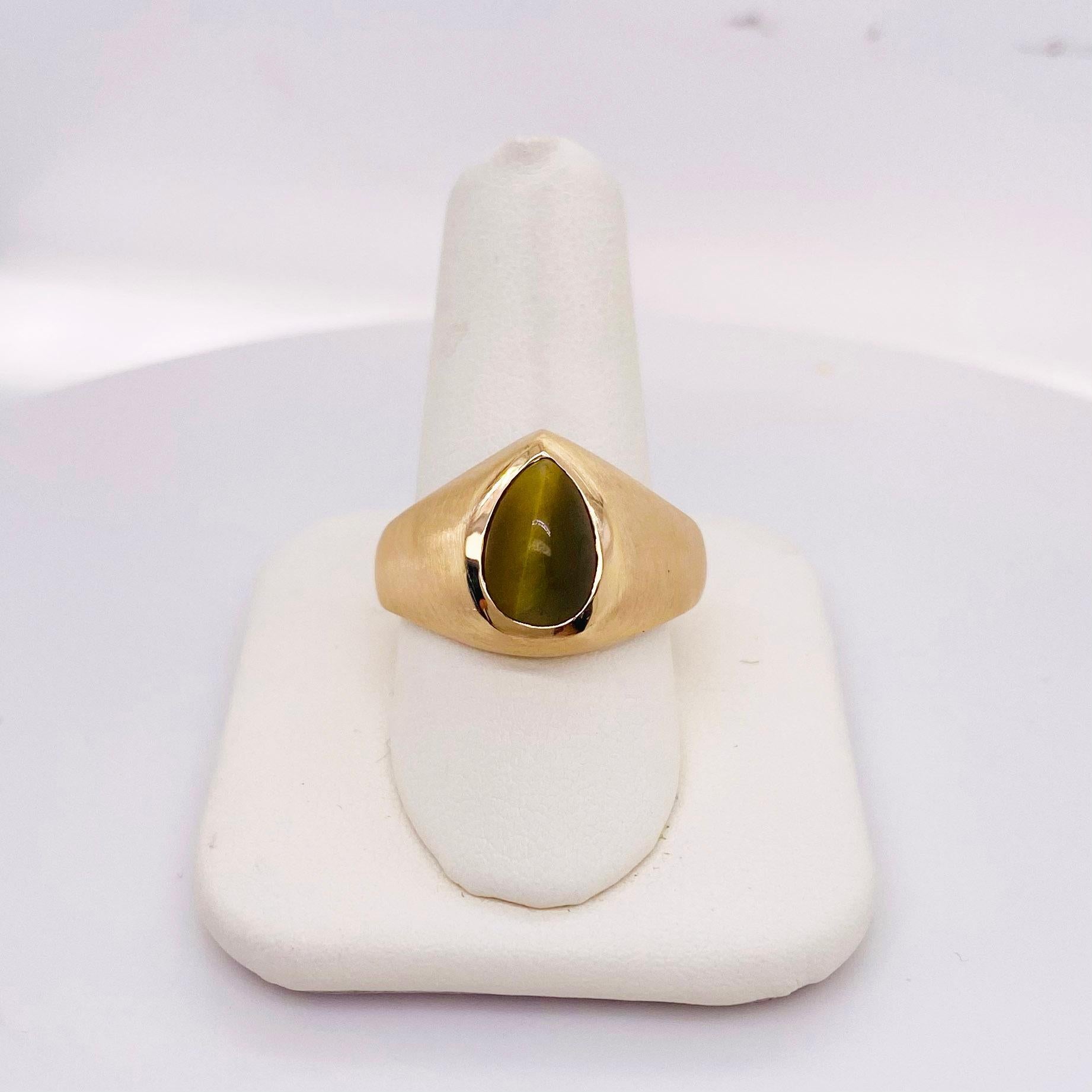 The man’s ring is 10 karat yellow gold with a honey tiger eye in well carved pear shape. The gold has a beautiful brush finish that would look amazing on any finger. The details for this beautiful ring are listed below:
Metal Quality: 10 k