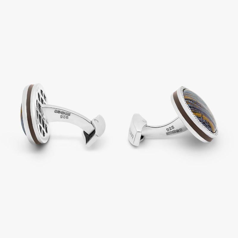 Tiger Iron Cufflinks in Sterling Silver, Limited Edition

Organically formed bands of hematite, jasper, chert, and quartz create the stones metallic layers, reminiscent to stripes of a tiger, giving its name 