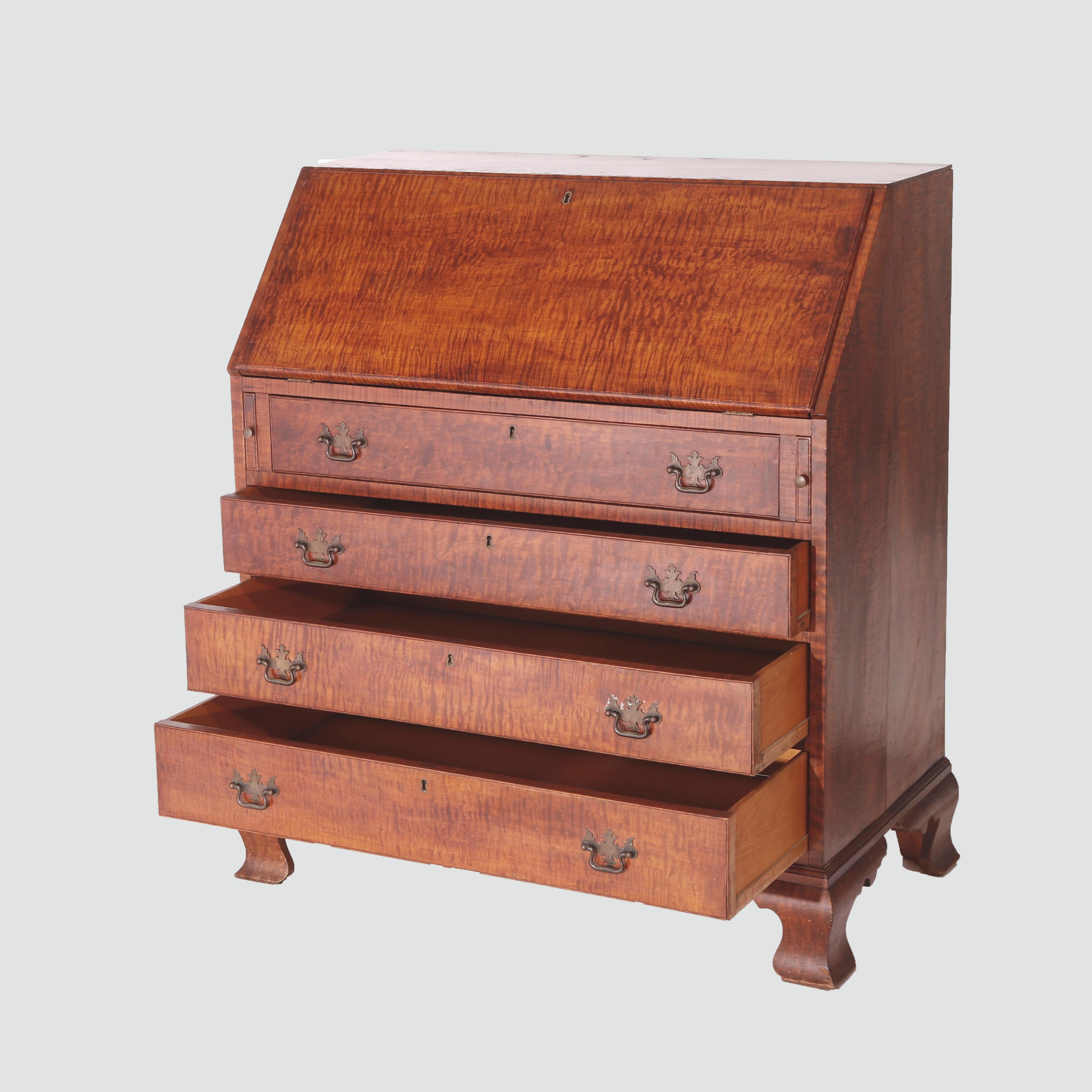 A Chippendale style secretary offers tiger maple construction with drop front desk over case having four drawers, raised on bracket feet, 20th century

Measures - 41.25