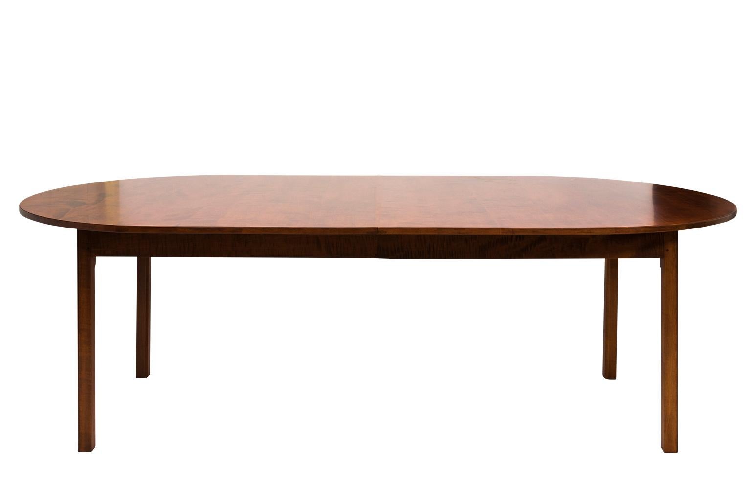 Contemporary Danish style Tiger Maple dining room table by David LeFort, circa 2000. Table consists of three leaves that measure 14.75 inches each.
 