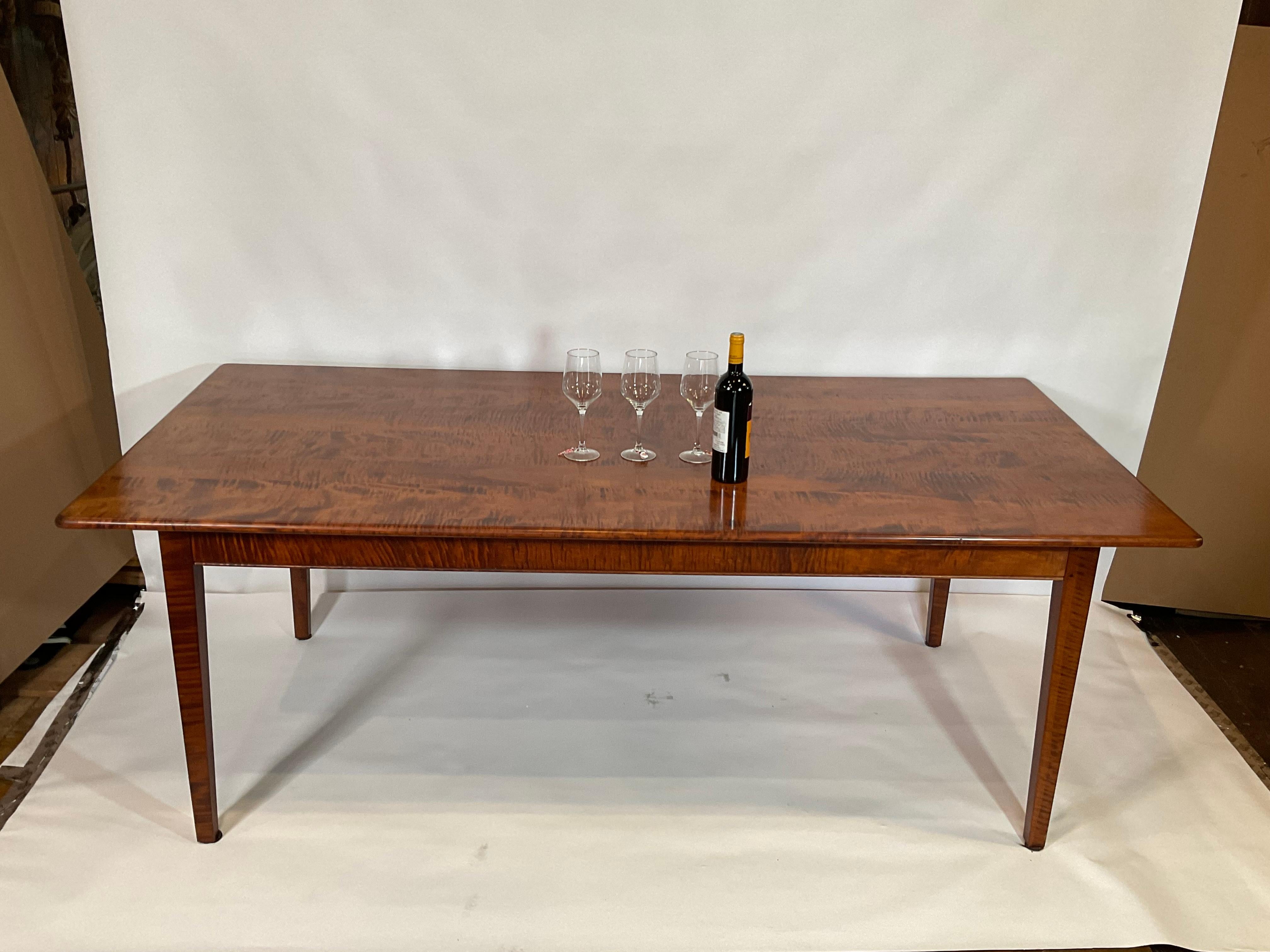 Spectacular rare lumber dining table. Fantastic selection of tiger grained maple. Beautiful form. Tapered legs. Custom made.

Weight: 82 LBS
Overall Dimensions: 29” H x 40” W x 82” L
Made: America
Material: Maple
Date: 2000