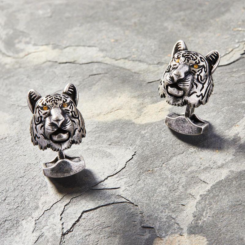 Tiger Mechanical Cufflinks with Orange Swarovski Elements

Tiger cufflinks incorporate movement found in real life animals. Perfect for people in business, this style is made from oxidised base metal and finished with orange crystal eyes. These