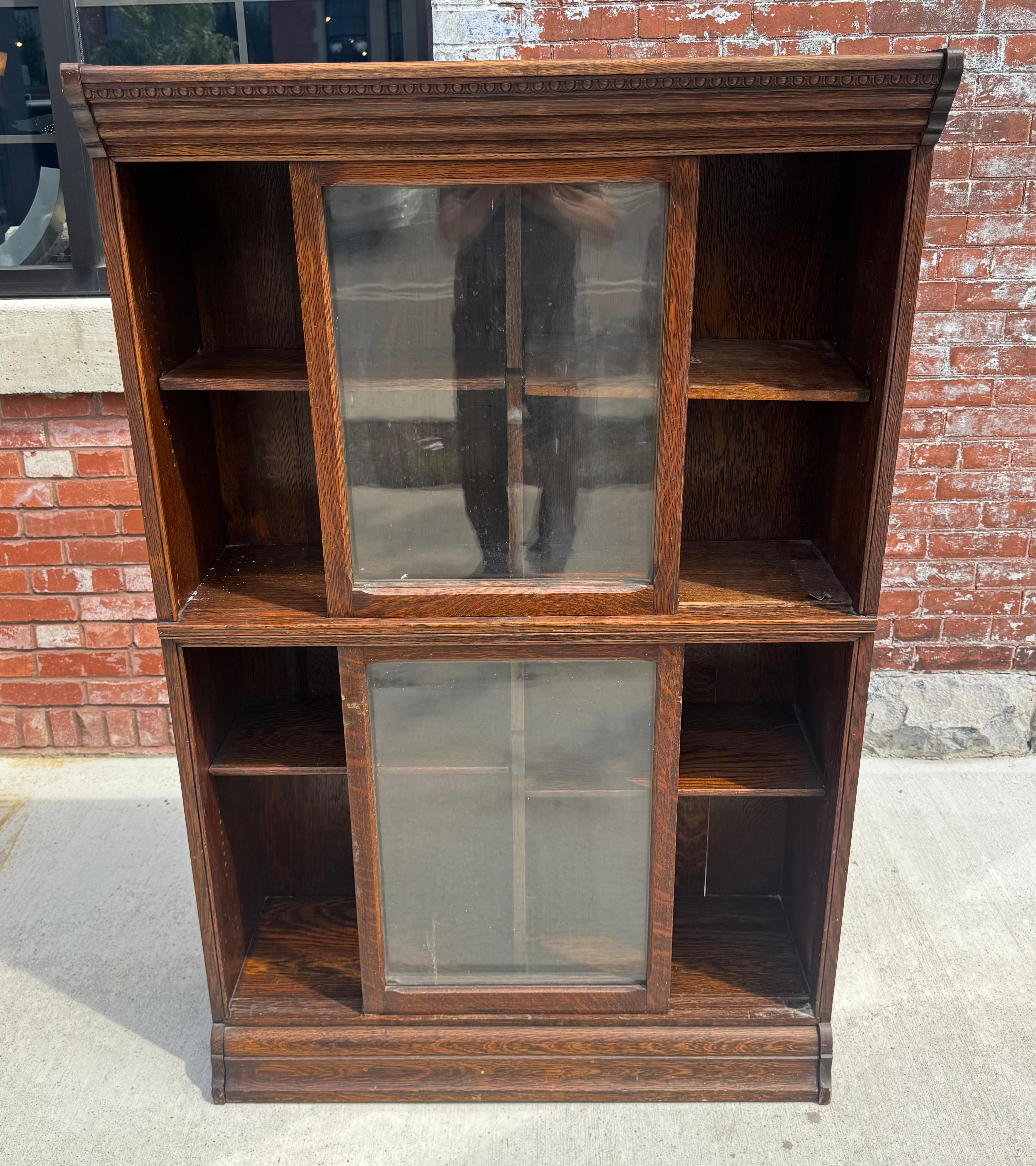Antique Tiger Oak Bookcase with Sliding Doors in Style of Globe Wernicke, Ca 1900s...3-section.. Original warm patina. Retains it's original wavy glass. Beautiful beaded top detailing. Four original adjustable shelves. Hand delivery avail to New