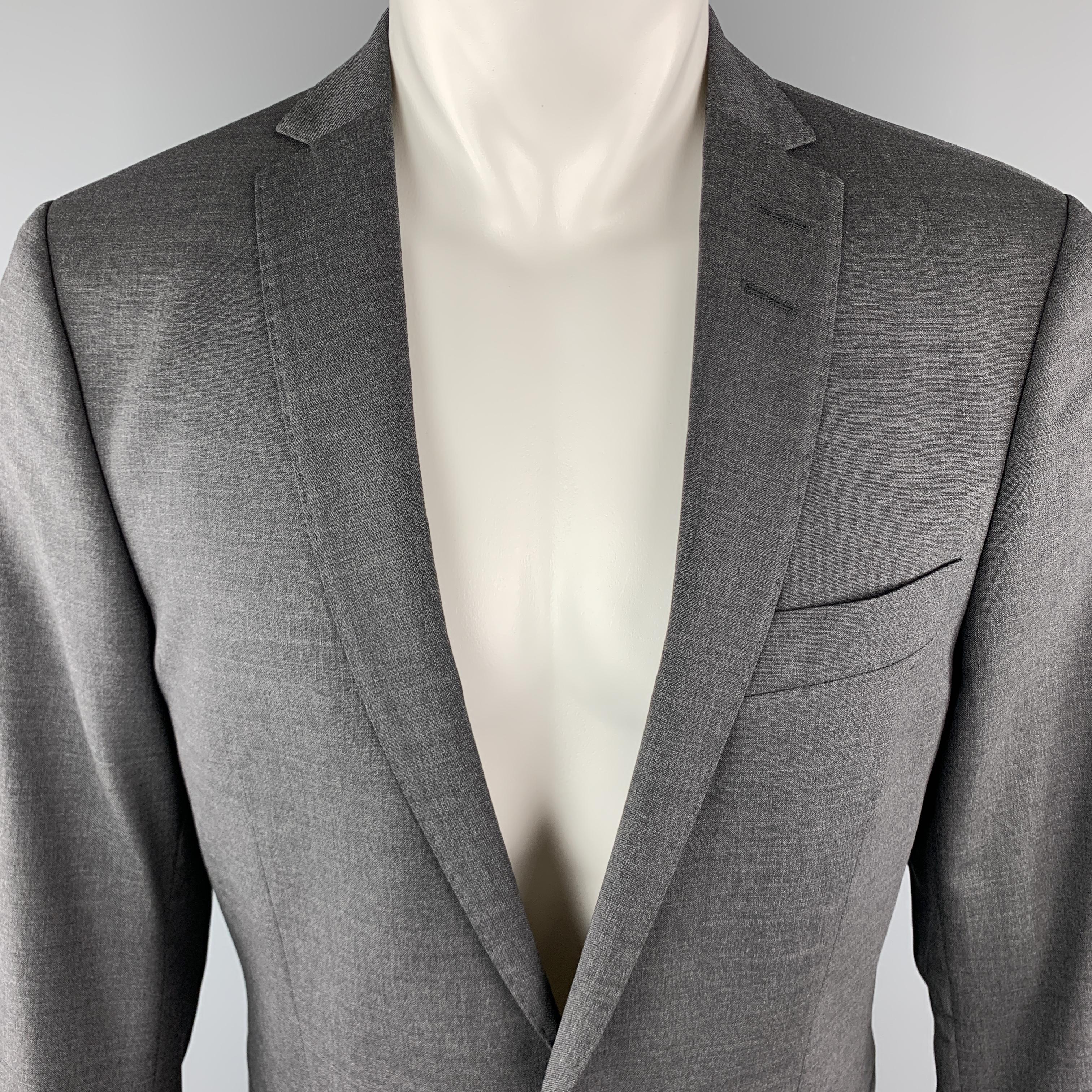 TIGER OF SWEDEN Sport Coat comes in a dark grey tone in a solid wool material, with a notch lapel, slit and flap pockets, two buttons at closure, buttoned cuffs, and a double vent at back. Made in Romania.

New With Tags.
Marked: IT