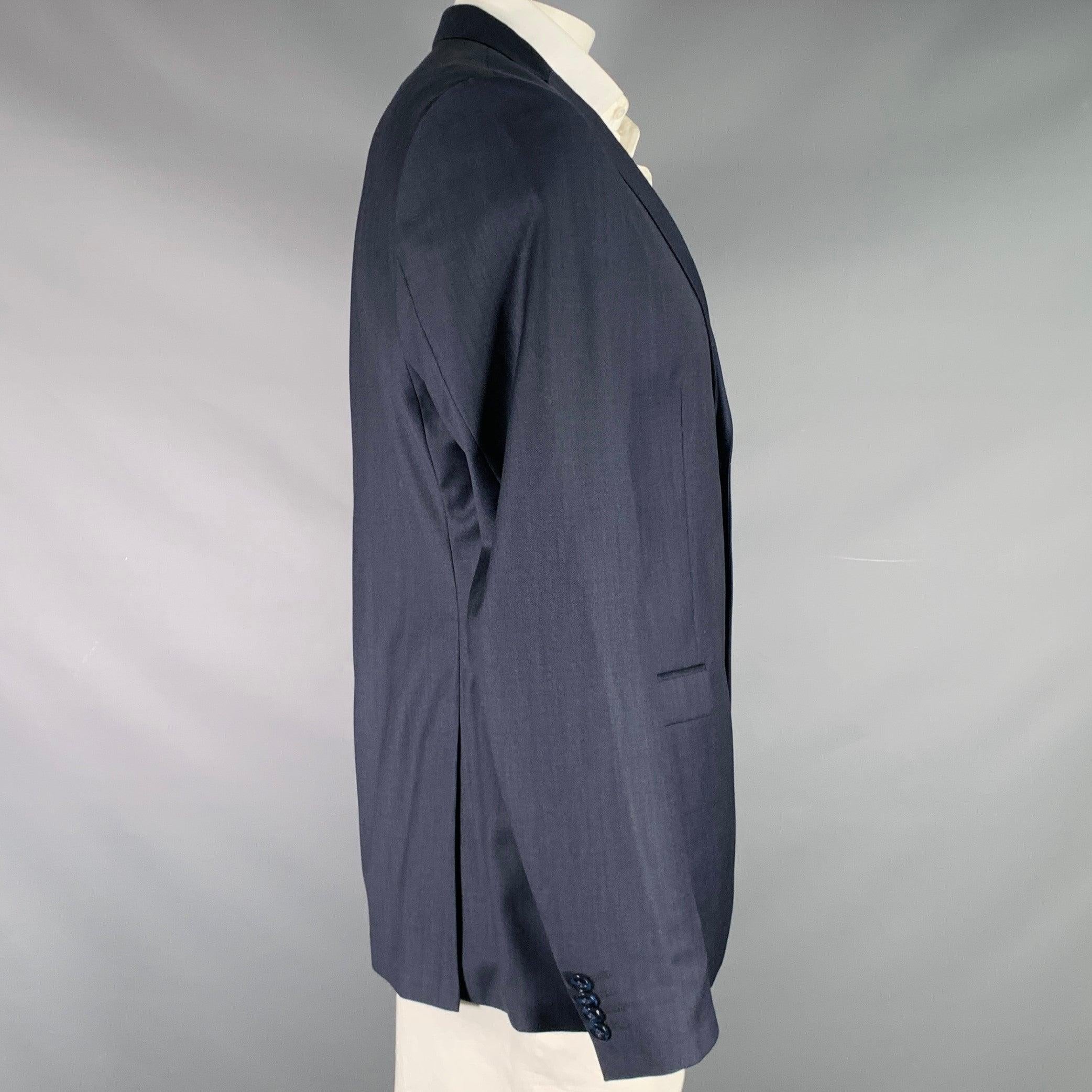 TIGER OF SWEDEN sport coat
in a navy wool fabric featuring notch lapel, double vented back, and double button closure. Made in Romania.Excellent Pre-Owned Condition. 

Marked:   56 

Measurements: 
 
Shoulder: 16.5 inches Chest: 46 inches Sleeve: 27