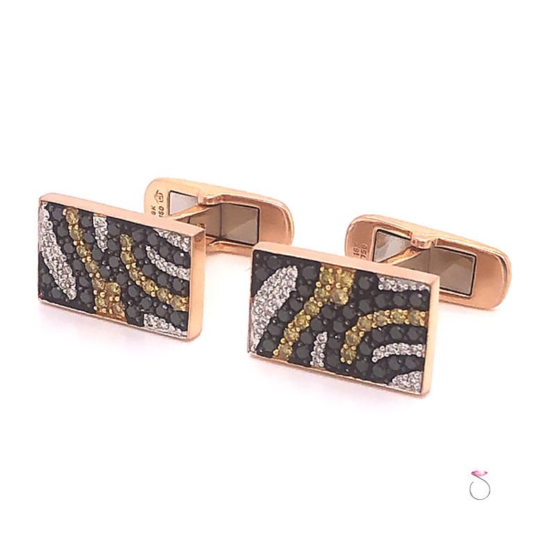 Stunning designer multi color diamond cufflinks in tiger print. These cufflinks are very well crafted in 18k rose gold and set with white, yellow and black diamonds in a tiger print design. The front of each cufflink measure 16.10 mm x 9.70 mm. A