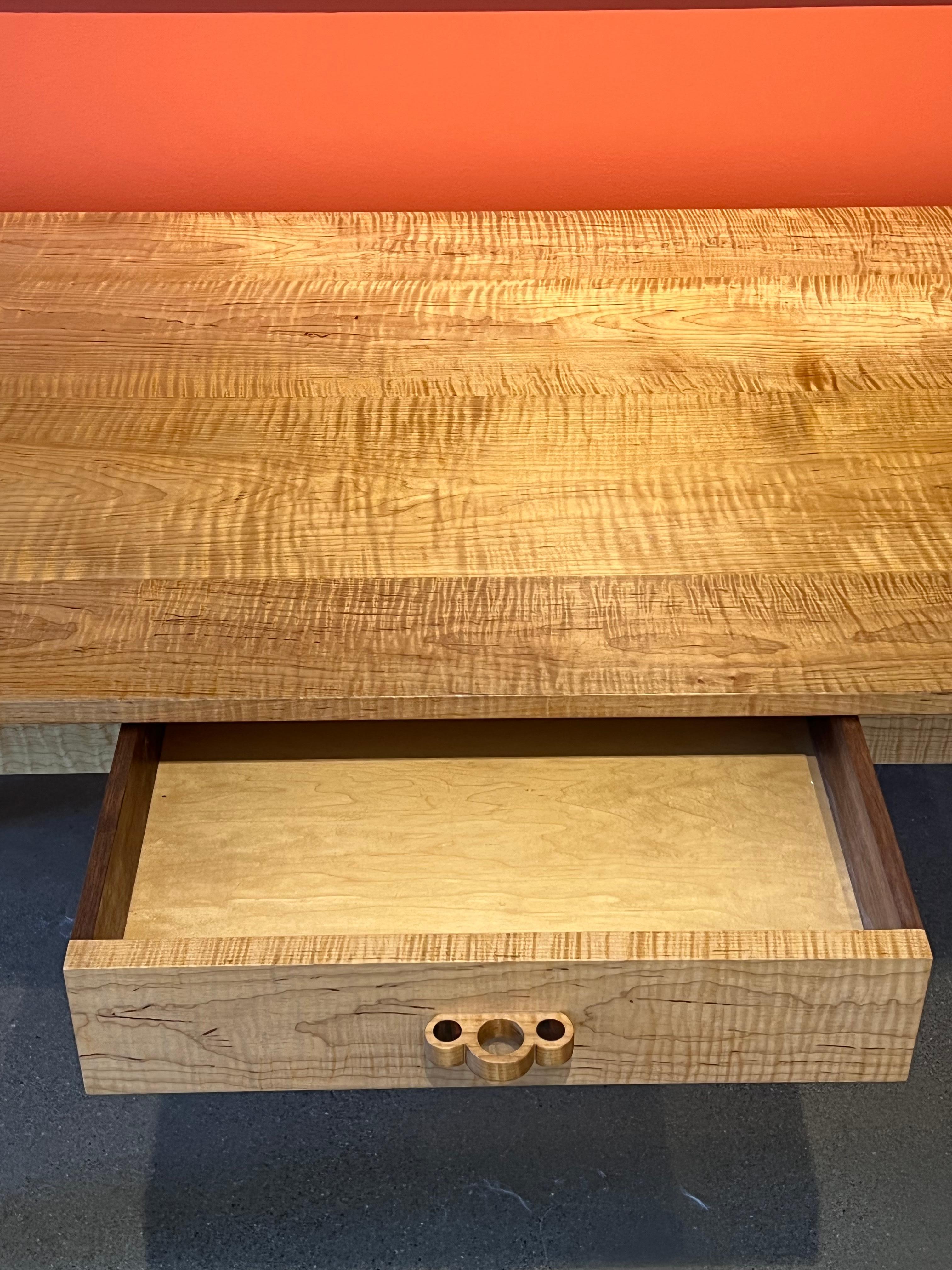Tiger striped maple table by Stuart Welch
Curly Maple, Claro Walnut details 29.5?H x 31.5?W

About the artist: 
People often ask where do I get my ideas? Early on I was fortunate to be exposed to wonderful teachers. Wendell Castle, James Krenov,