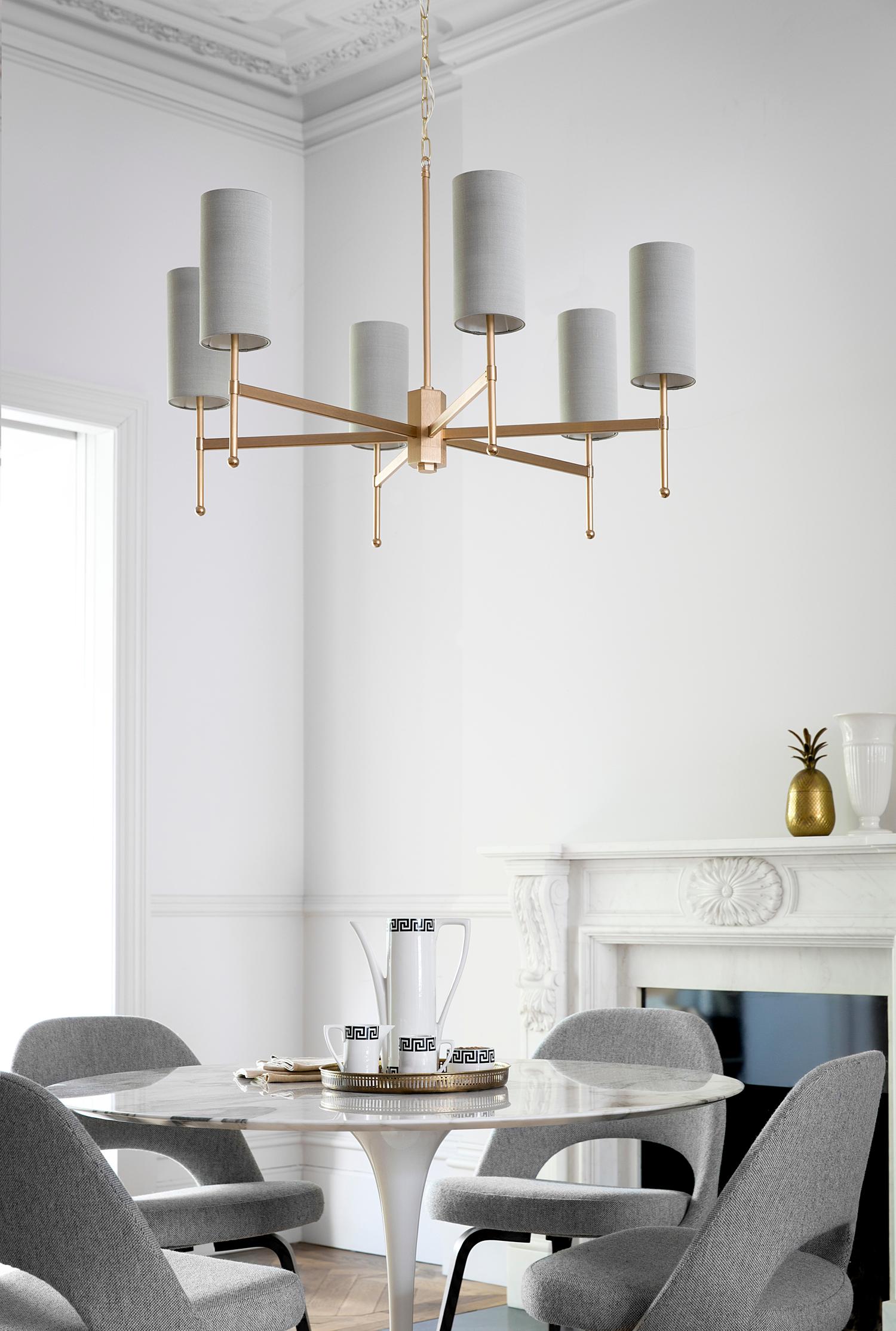 An elegant chandelier featuring a handcrafted metal stem frame, supporting beautiful silk douppion shades. The hand-grained Gold metalwork is perfectly balanced by the richness of silk shades.

Designed and handmade by Tigermoth Lighting on the