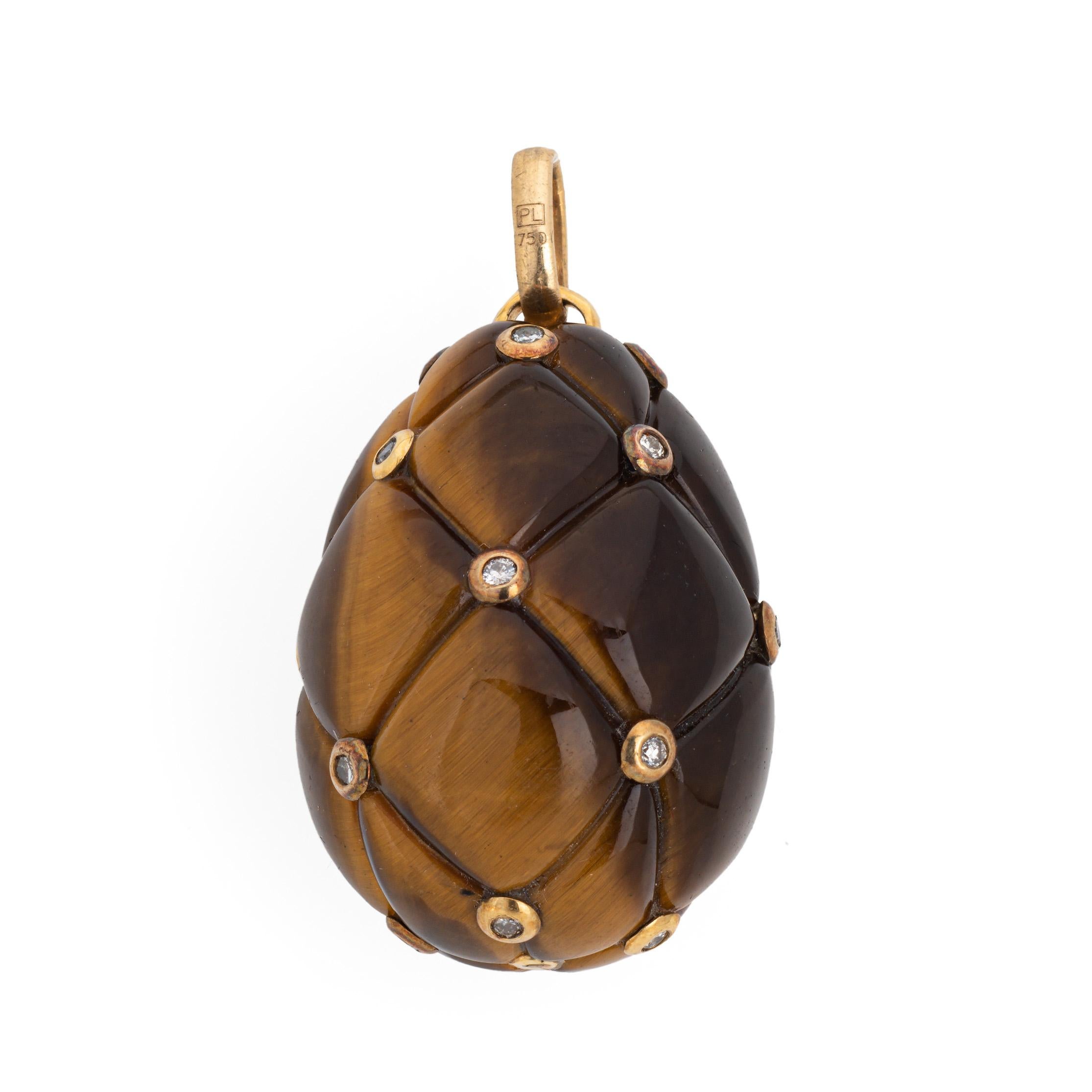 Finely detailed tigers eye & diamond egg pendant crafted in 18k yellow gold.  

Carved in a quilt pattern with diamond set points, the large pendant (or charm) makes a statement! The luminous tigers eye exhibits beautiful golden flashes in direct