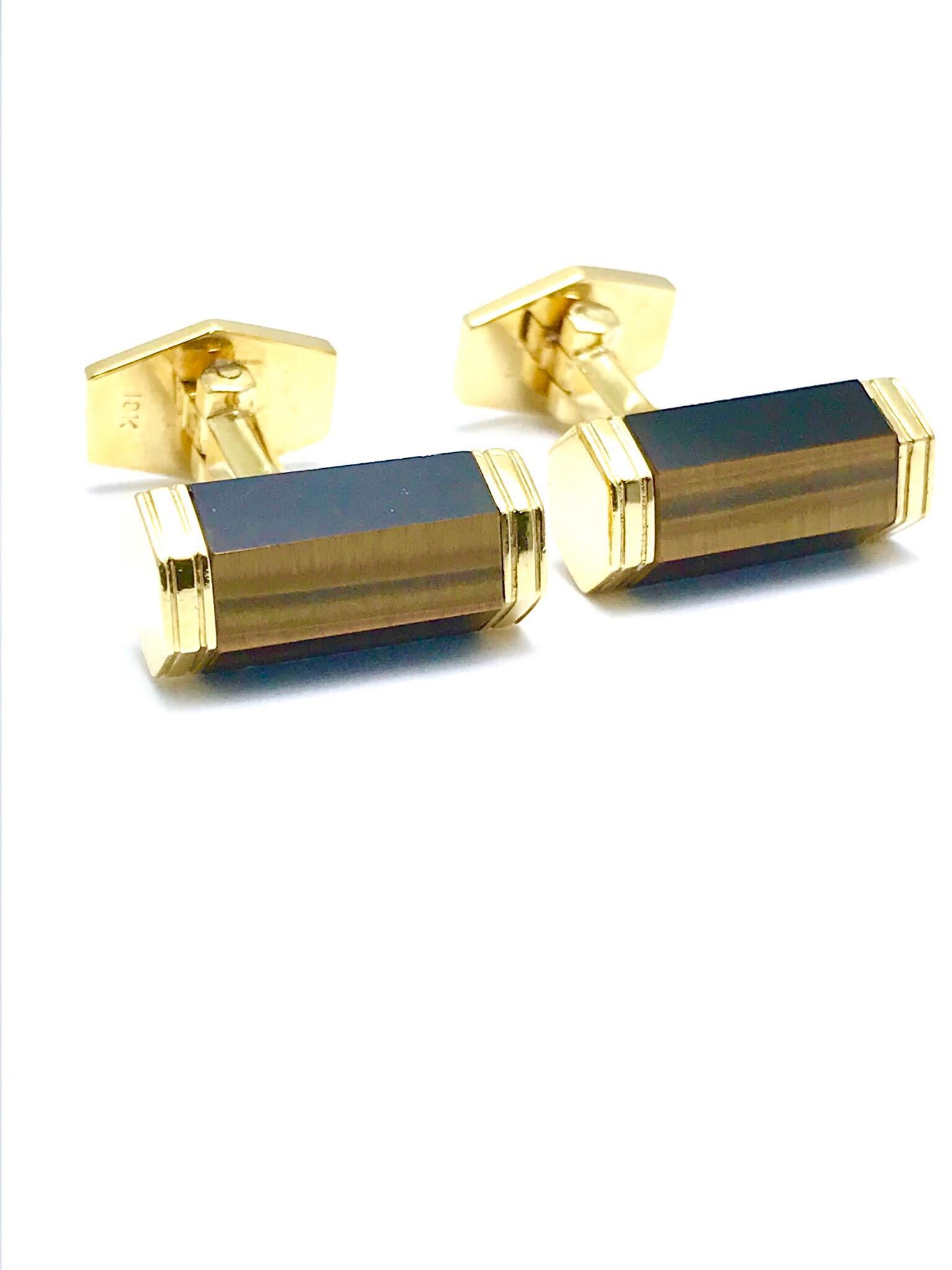 These are a great pair of cufflinks to own!  Made up of Tiger's Eye Quartz and 18 karat yellow gold with an easy to use toggle back made with tigers eye quartz as well.  They are a very versatile pair for anyone.  The cufflinks measure 19.90 mm from