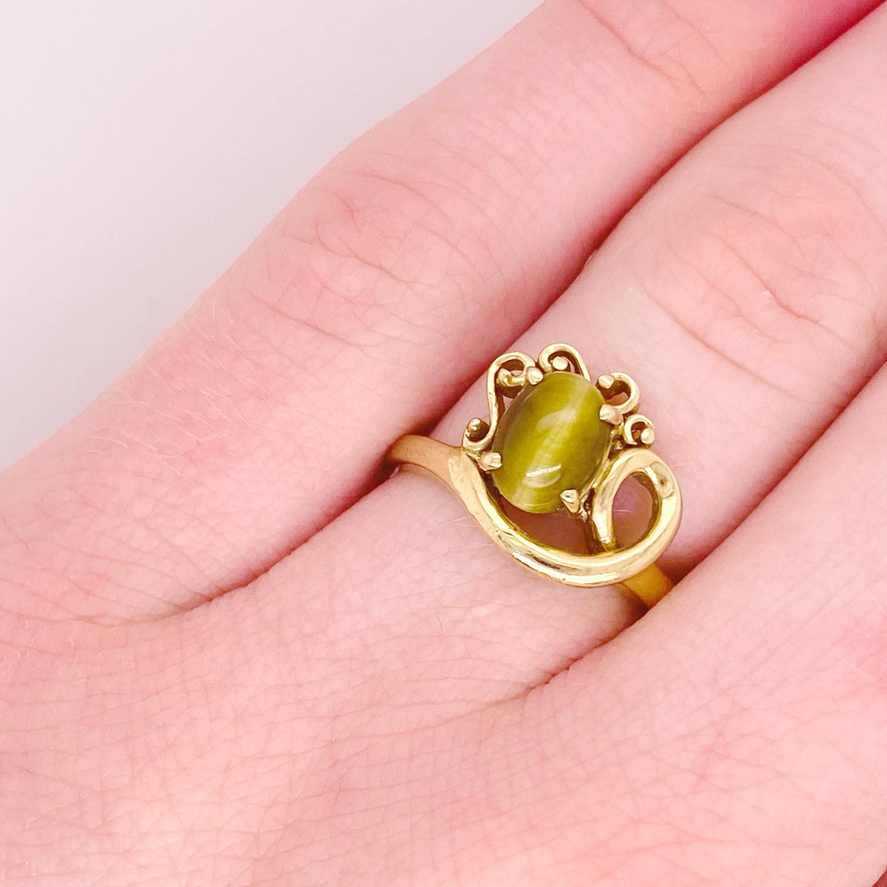 This 14 karat yellow gold ring has a honey colored tiger’s eye gemstone that will wink at you with every roll or your hand! The asymmetrical design is so popular and trending with all the designers. Buy this estate ring for 1/4th of what it would