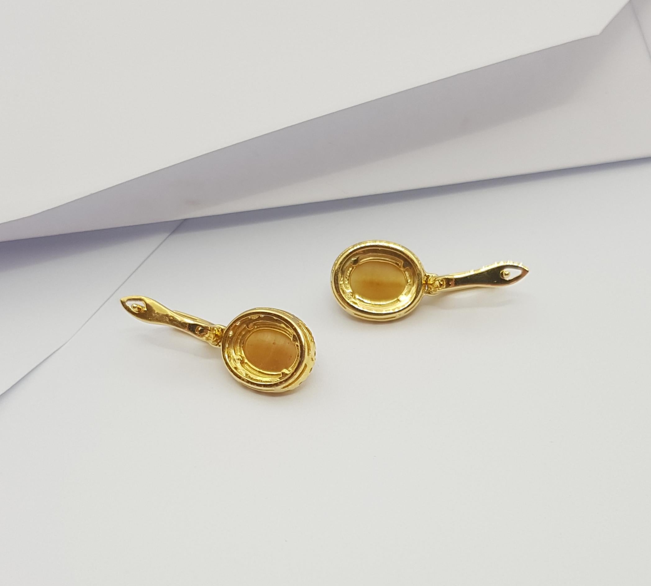 Tiger's Eye with Yellow Sapphire Earrings Set in 18 Karat Gold Settings For Sale 1