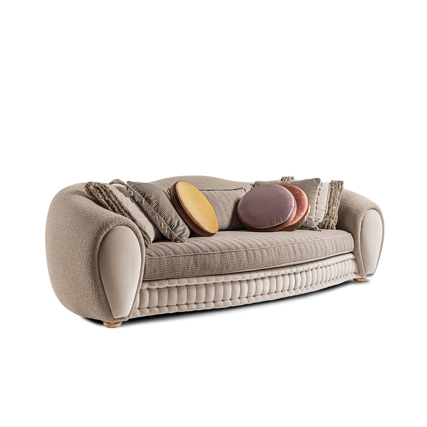A three-seater sofa with sinuous lines, upholstered in jacquard fabrics, it is complemented by decorative cushions and enriched with precious velvet details. The Tigran sofa offers comfort without sacrificing design and craftsmanship.