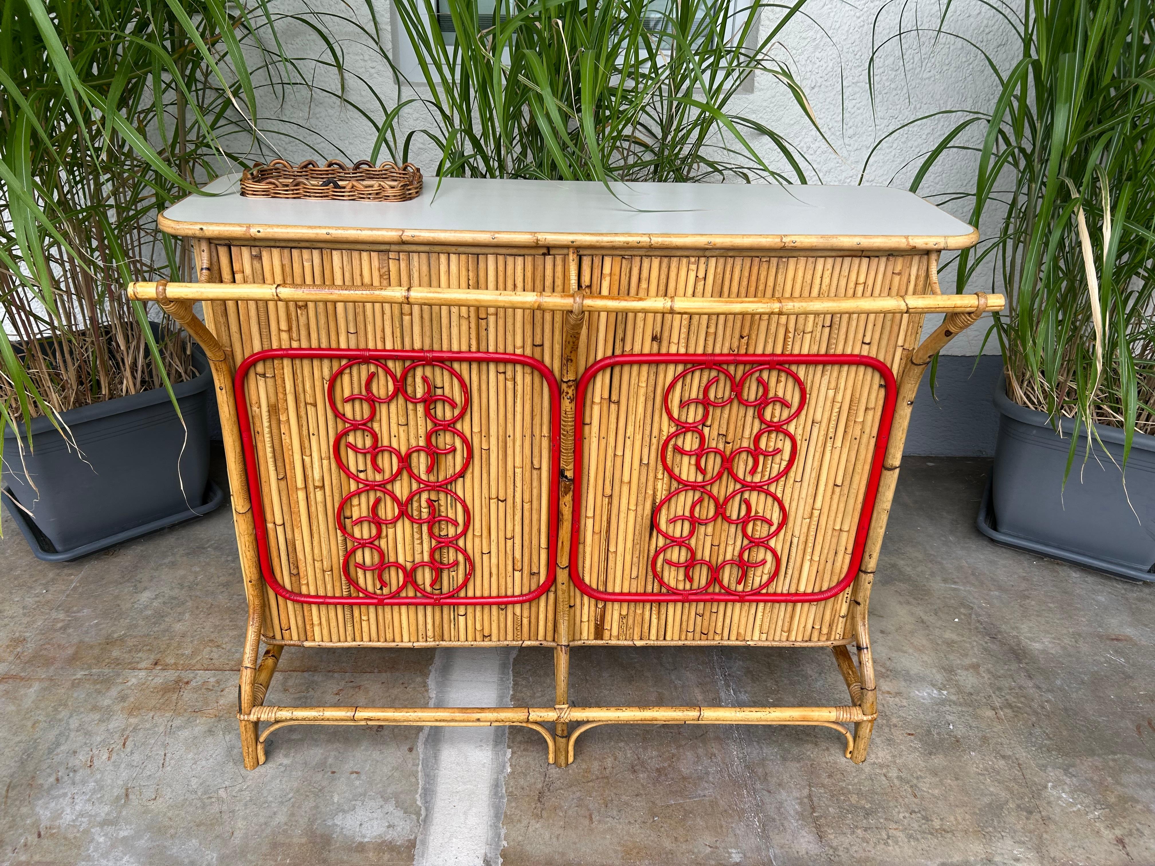 Skillfully handcrafted from Bamboo, Rattan and Reed, this is a great dry bar with a timeless design and a natural look and feel!

Hailing from Italy in the 1950's, and attributed to the award-winning Designer Tito Agnoli, this Tiki bar was most