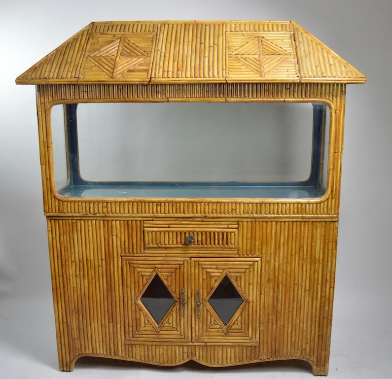 Nice extra large bamboo terrarium, probably originally an aquarium, however the bottom glass floor is cracked and not watertight. This will also function as a display case, reptile tank, or vivarium. The case consists of three elements, roof,