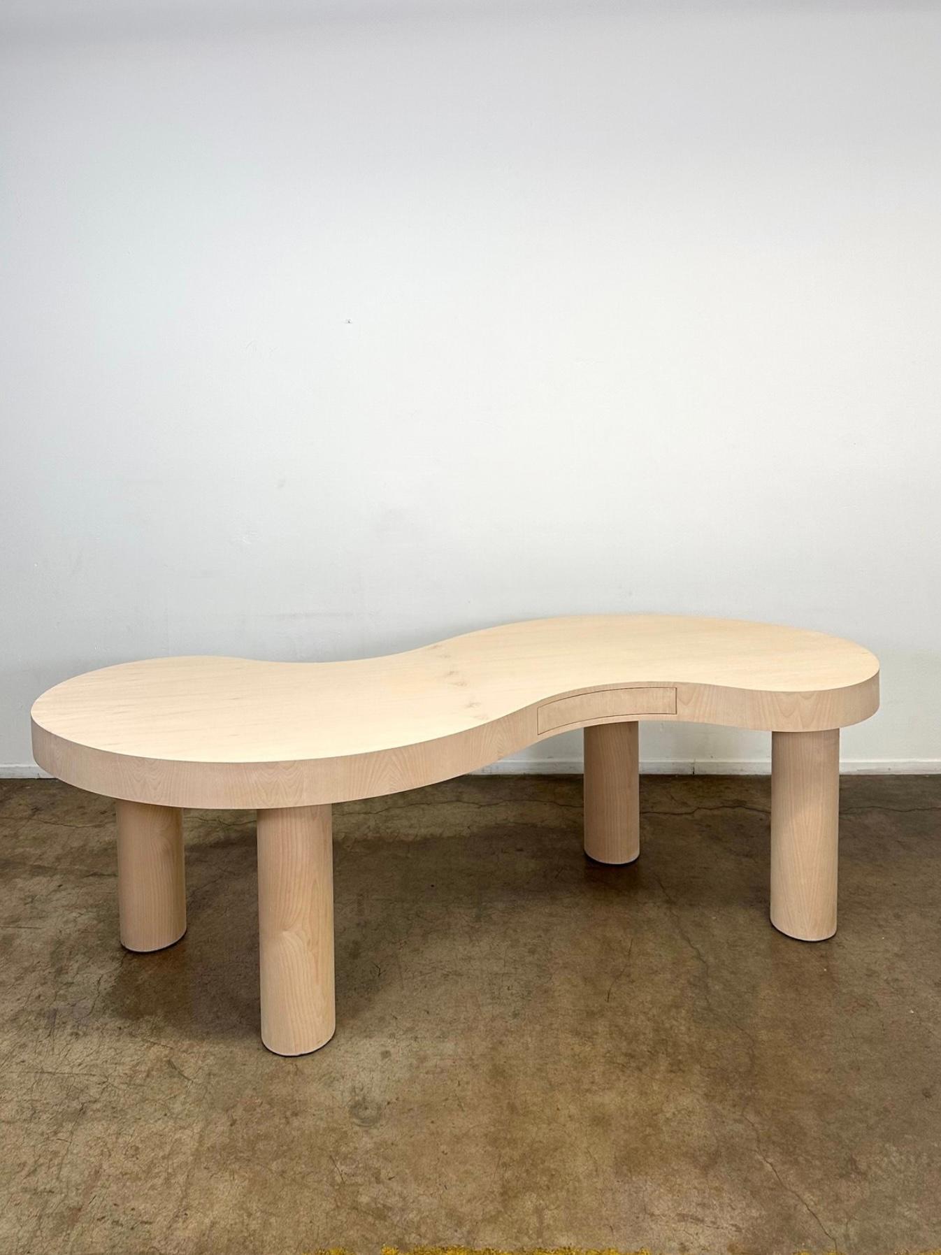 Measures: W95 D36 H30.5 KC25.5

Tilde (~) Coworking desk handcrafted in house, made in a mix of solid wood and birch veneer. Unsealed so that you can choose your own stain and finish. This squiggle like desk is designed to seat a person in each